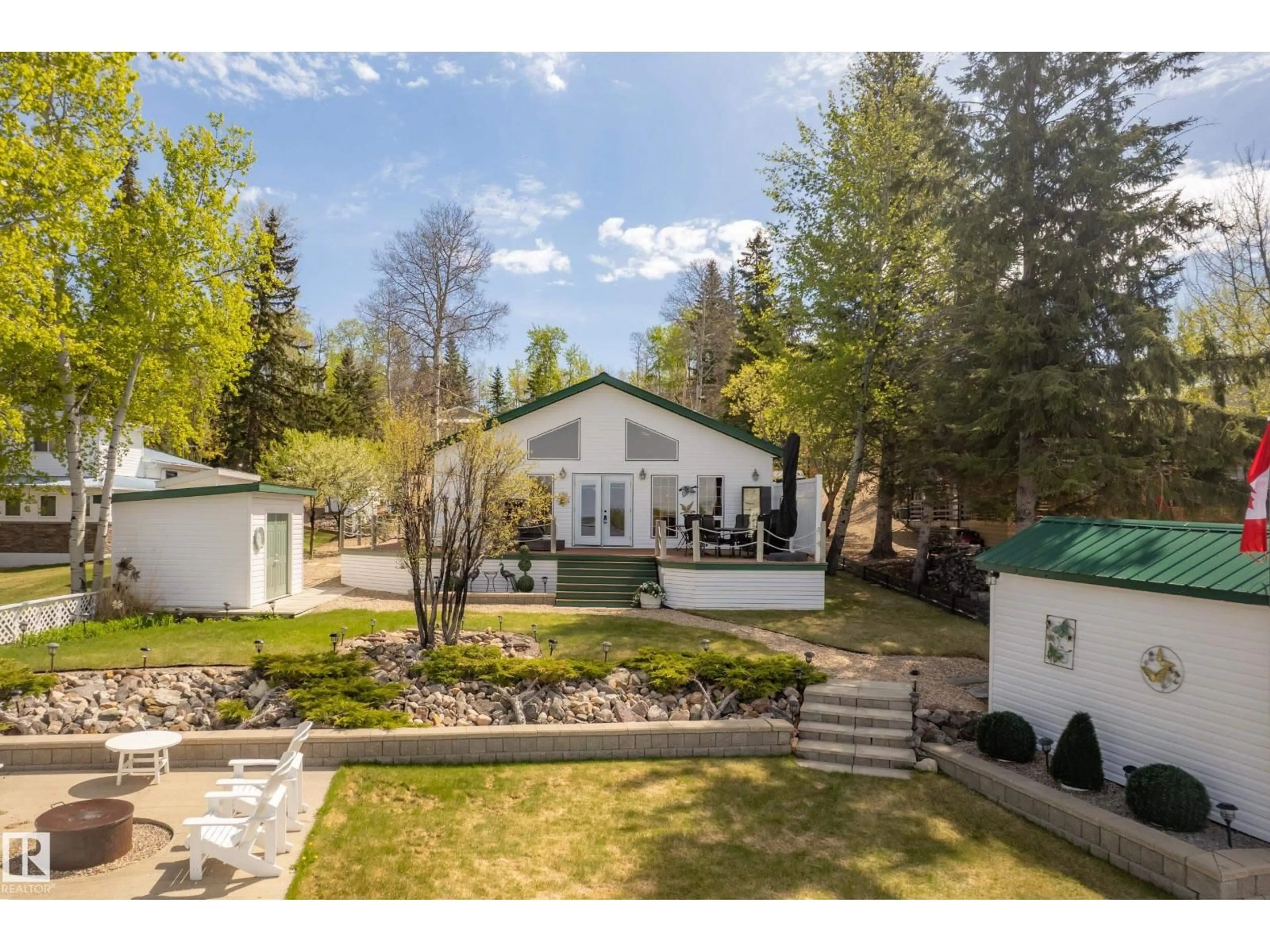 A pic from outside/outdoor area/front of a property/back of a property/a pic from drone, mountain view for 127 - 5415 TWP RD 594, Rural Barrhead County Alberta T7X1N3