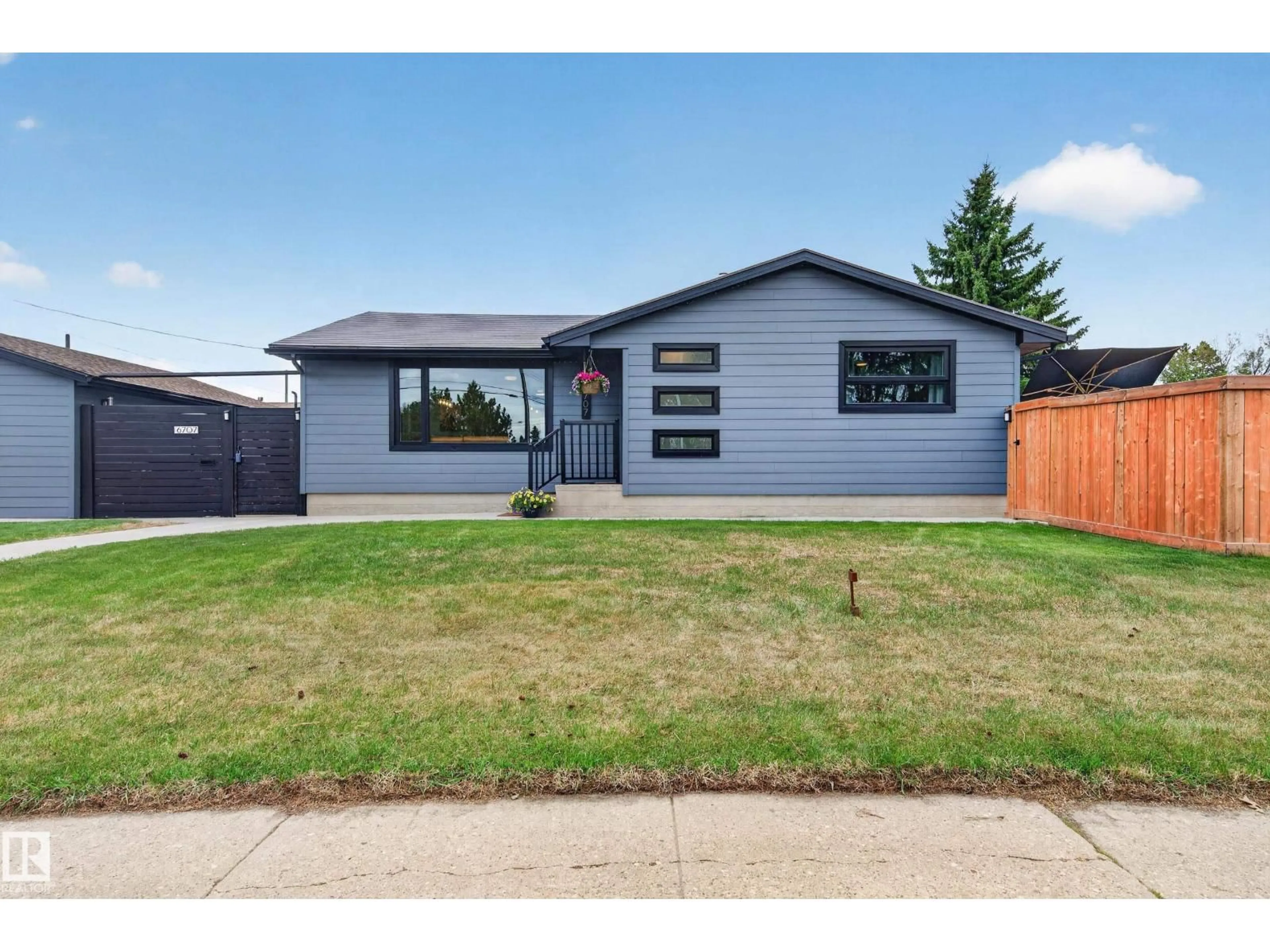 Home with vinyl exterior material, street for NW - 6707 92B AV, Edmonton Alberta T6B0V8