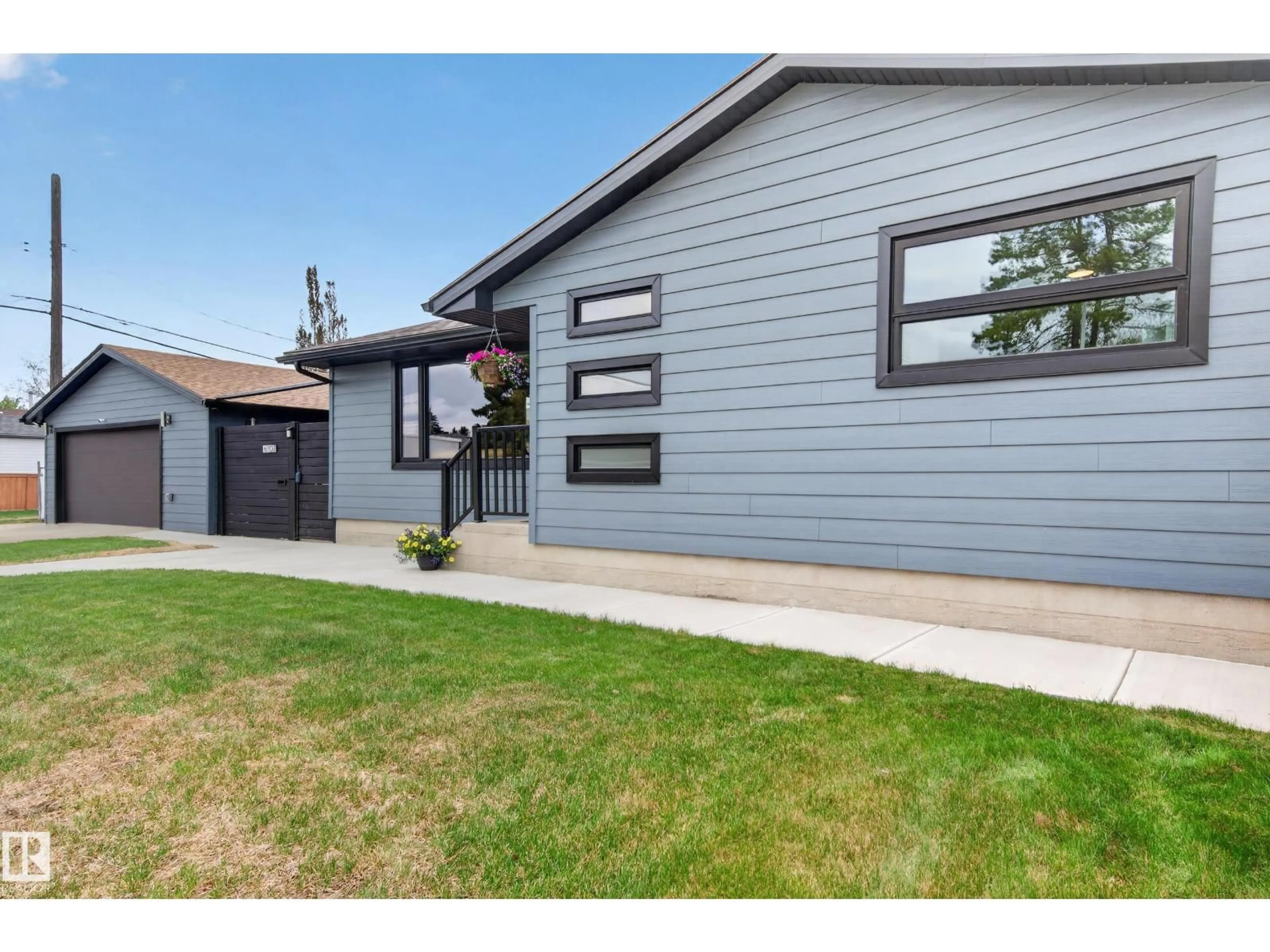 Home with vinyl exterior material, street for NW - 6707 92B AV, Edmonton Alberta T6B0V8
