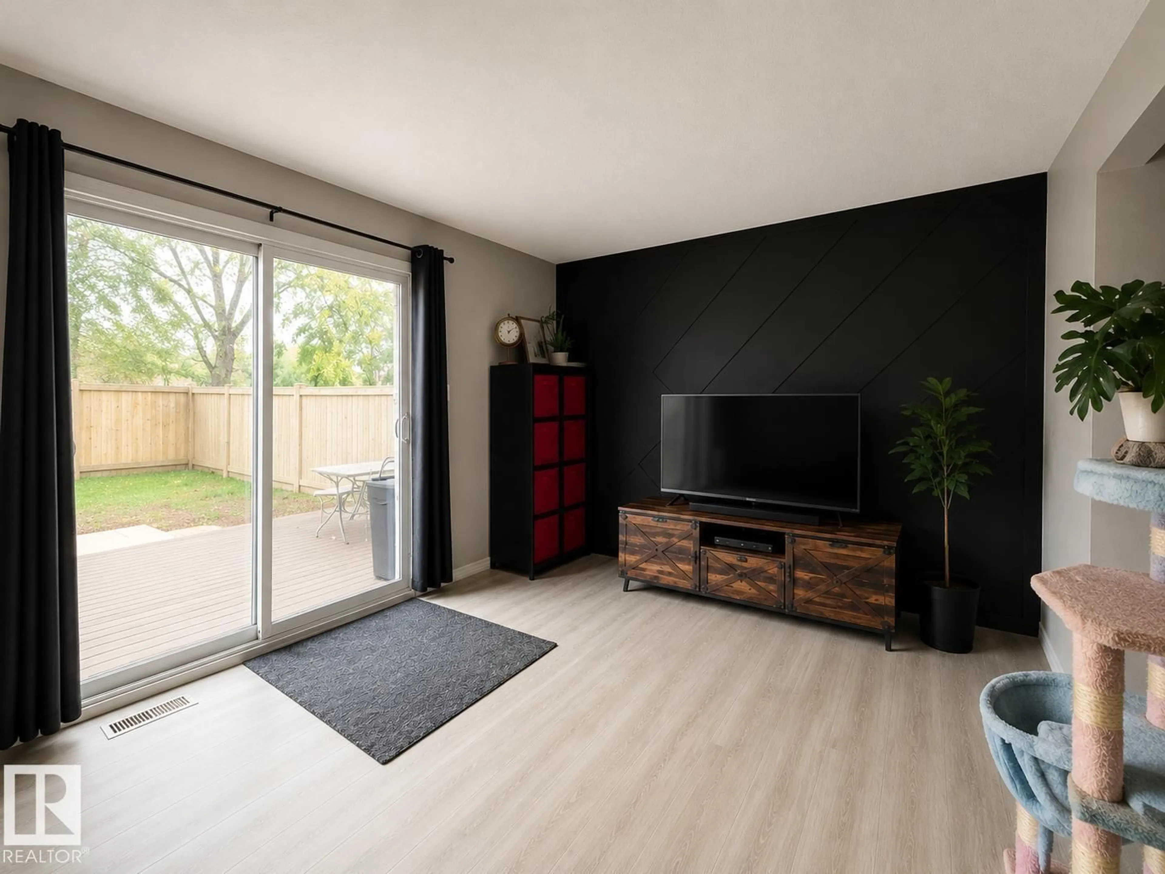 Living room with furniture, wood/laminate floor for 133 WOODSTOCK NW, Edmonton Alberta T5T0H6