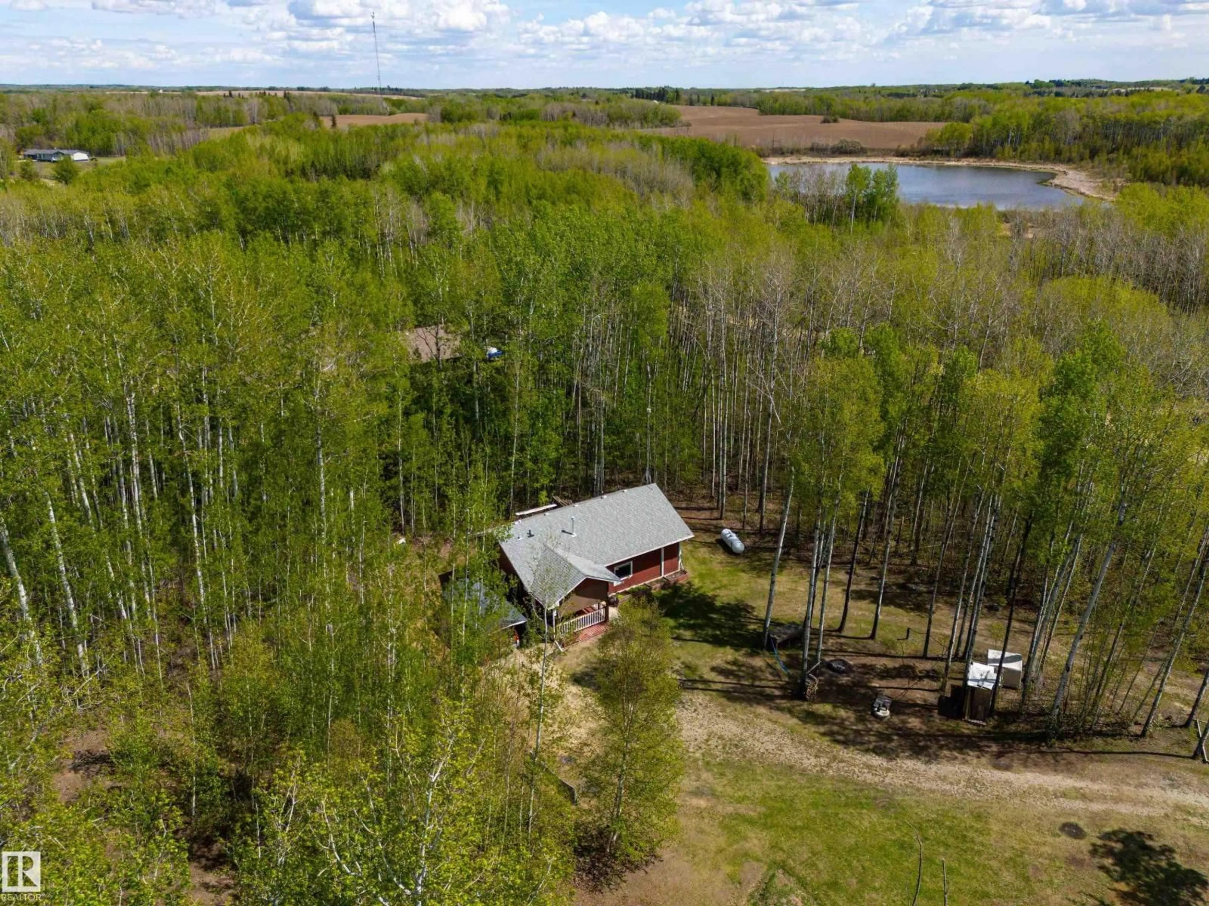 A pic from outside/outdoor area/front of a property/back of a property/a pic from drone, water/lake/river/ocean view for 36 52229 RGE ROAD 25, Rural Parkland County Alberta T7Y2M3