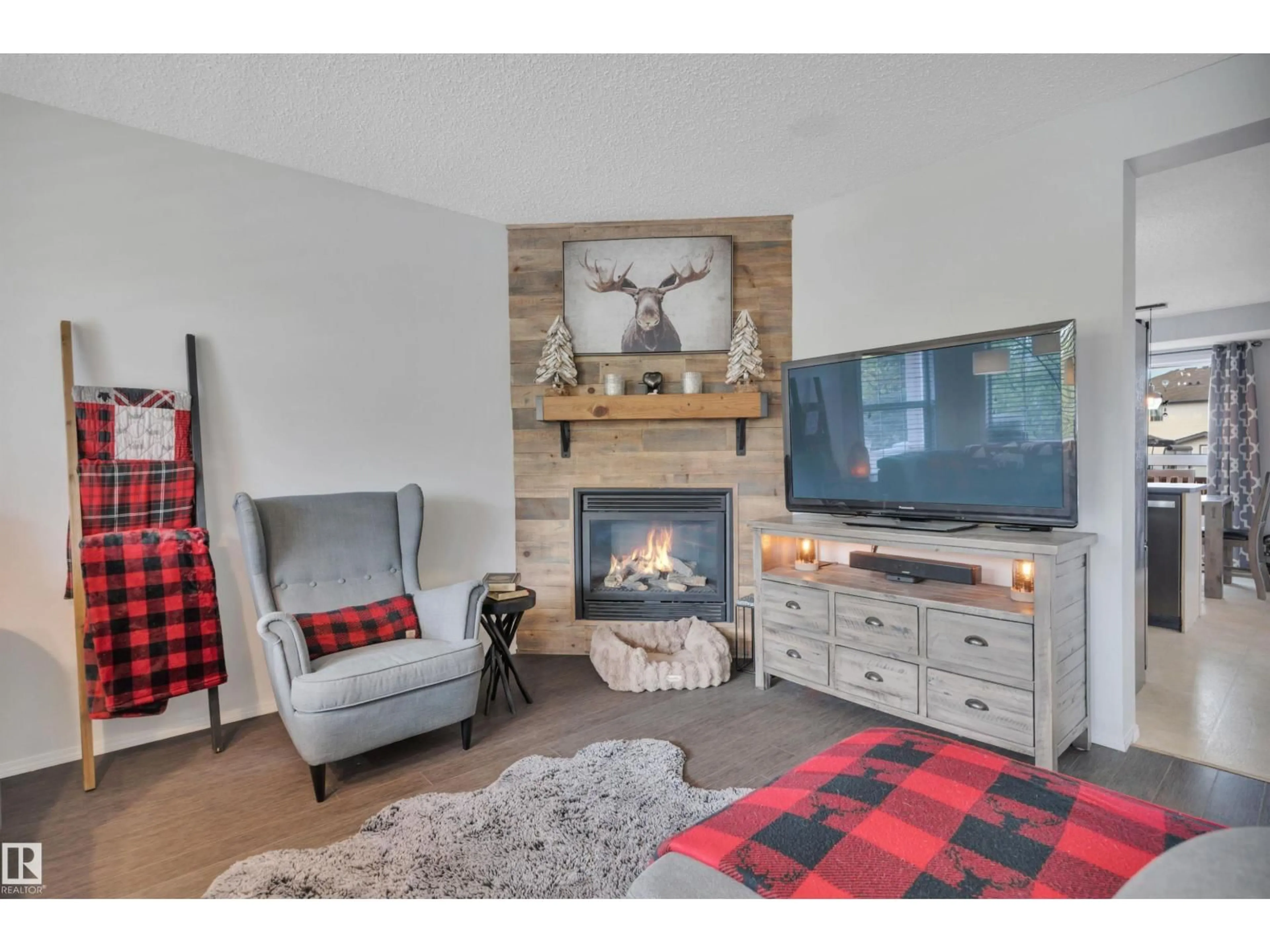 Living room with furniture, wood/laminate floor for 18 SOUTHWICK PT, Leduc Alberta T9E0G1