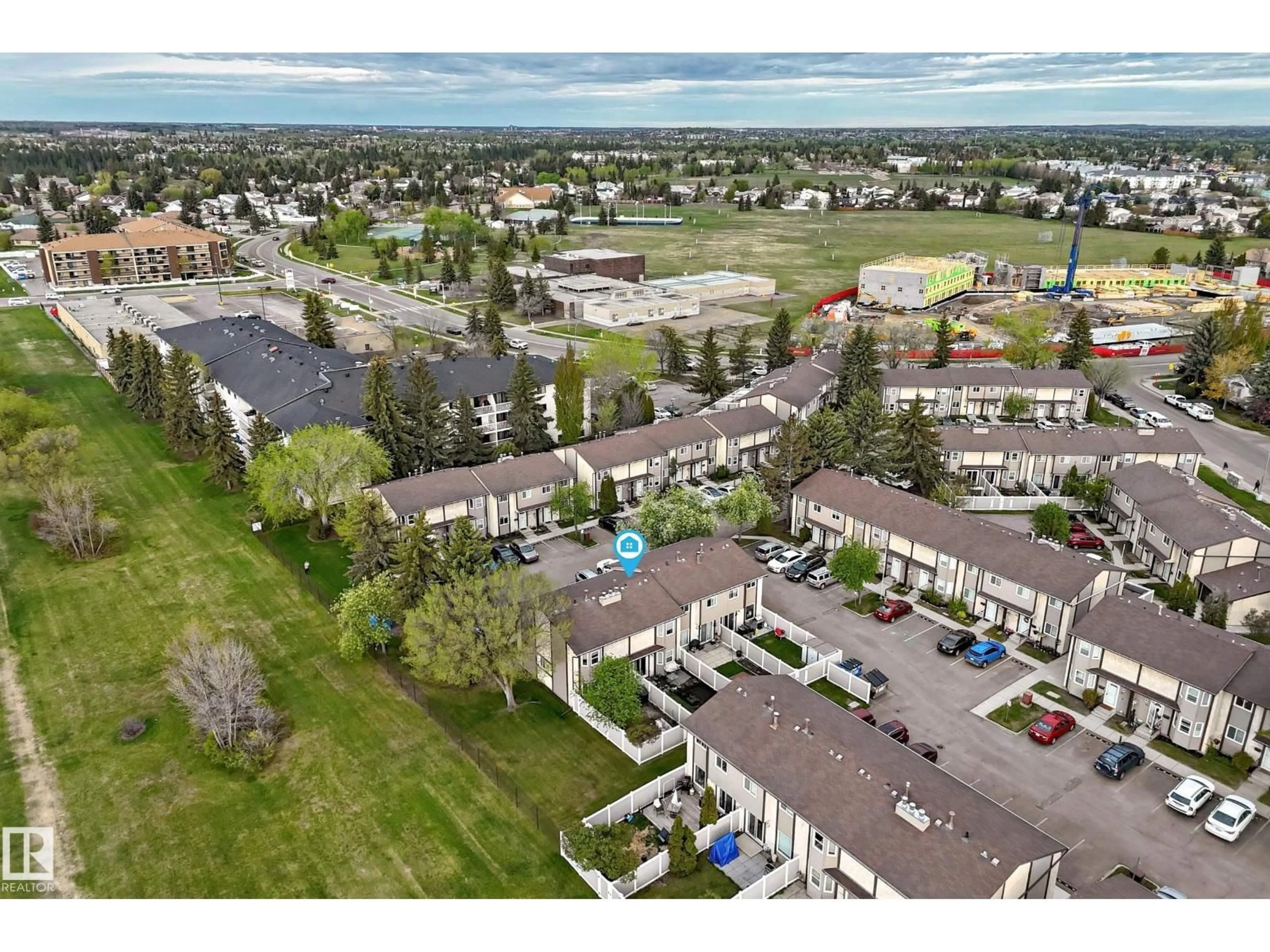 A pic from outside/outdoor area/front of a property/back of a property/a pic from drone, mountain view for #18 - 10453 20 AV, Edmonton Alberta T6J5A1