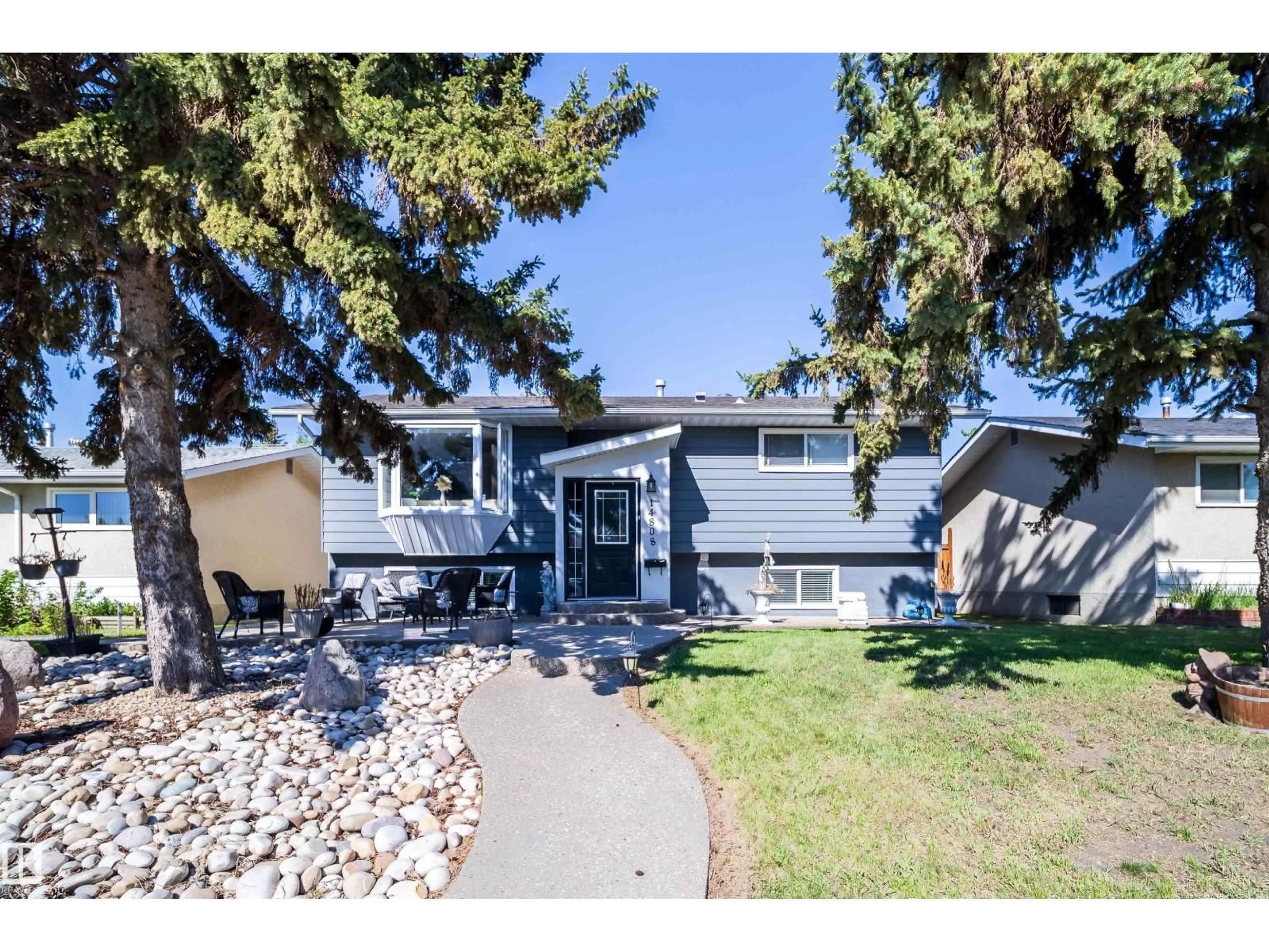 Home with vinyl exterior material, street for NW - 14808 96 ST, Edmonton Alberta T5E4W7