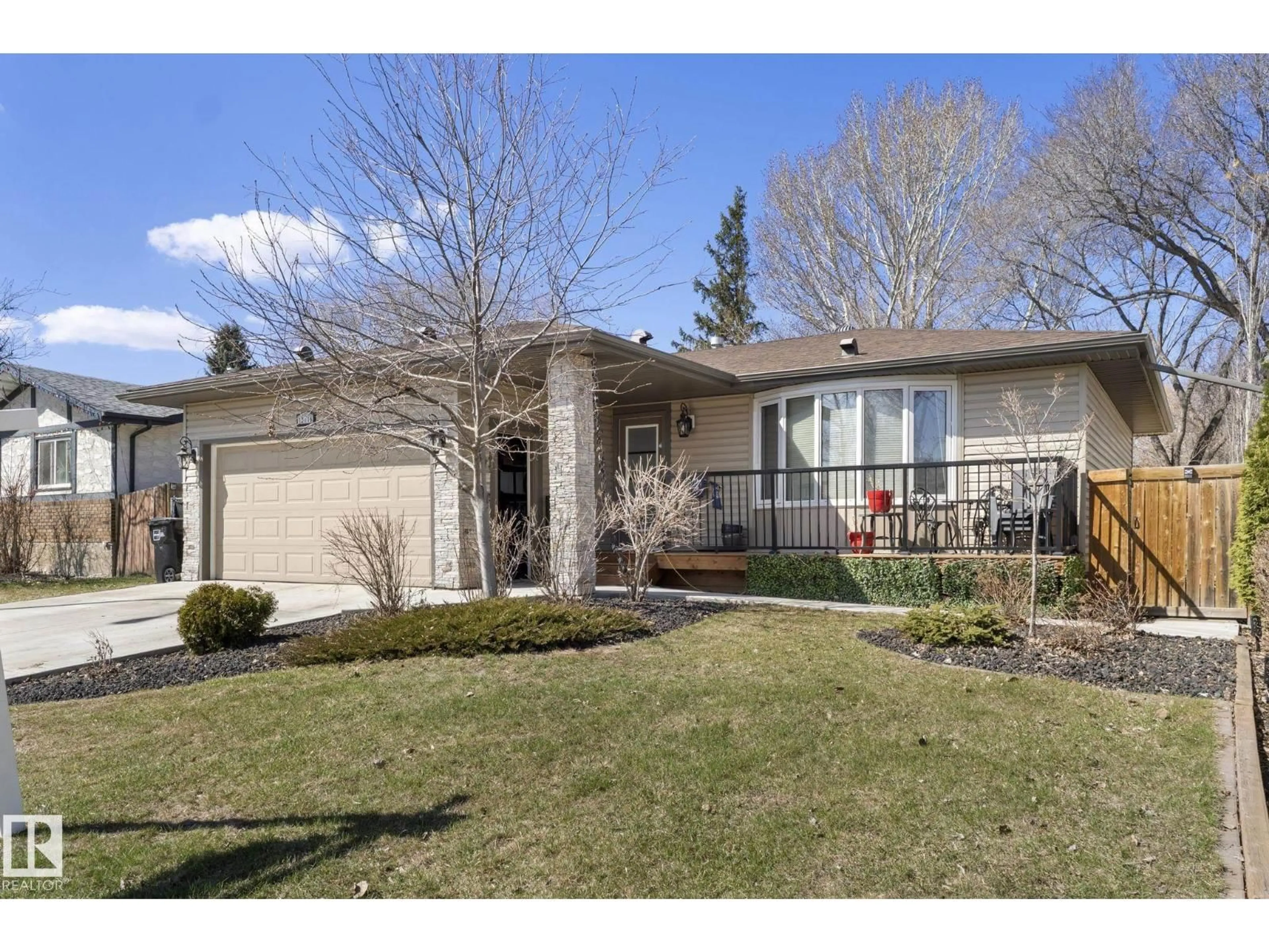Home with vinyl exterior material, street for 12116 148 AV, Edmonton Alberta T5K1V6