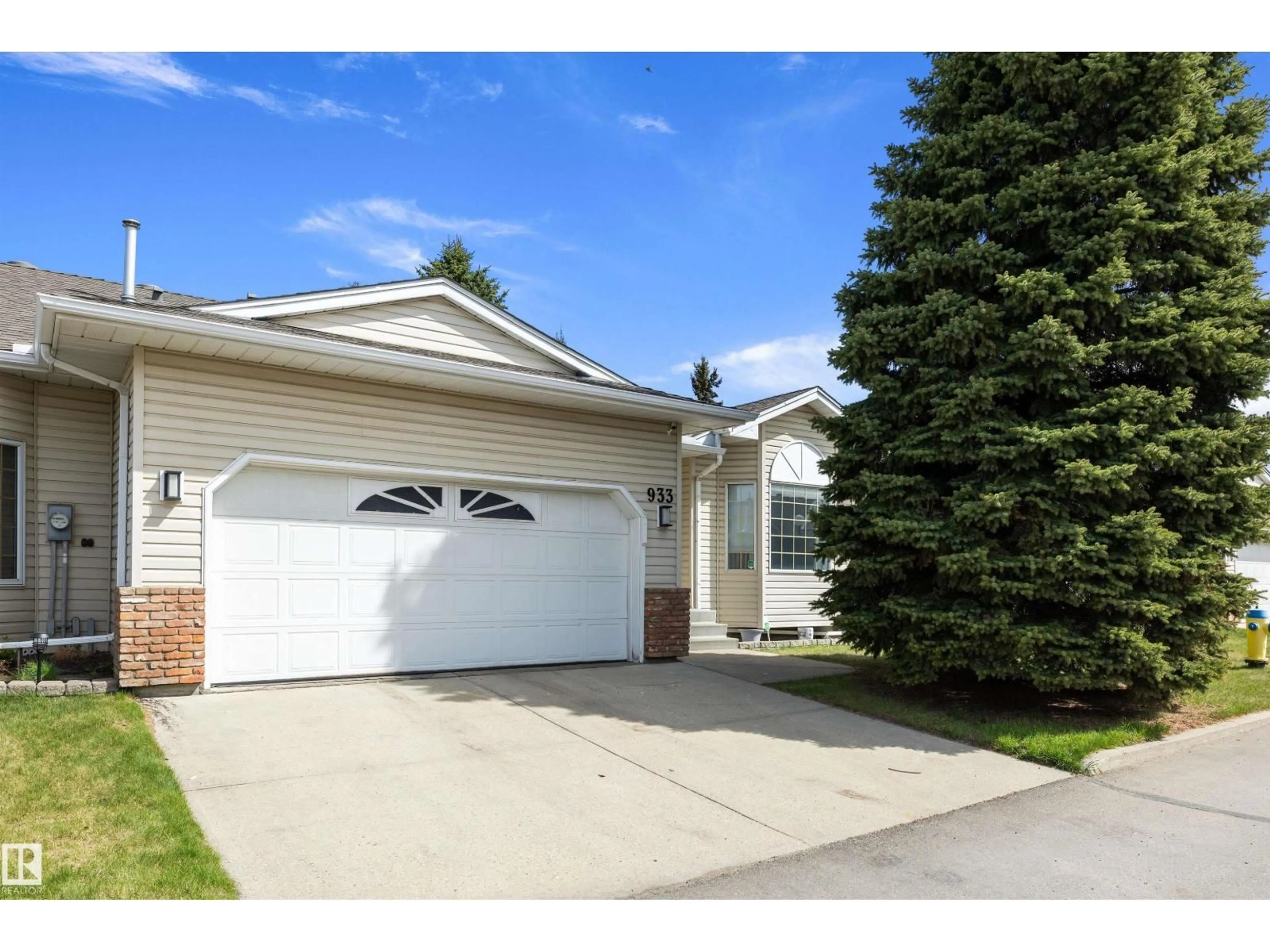 Home with vinyl exterior material, street for NW - 933 YOUVILLE DR W, Edmonton Alberta T6L6T2