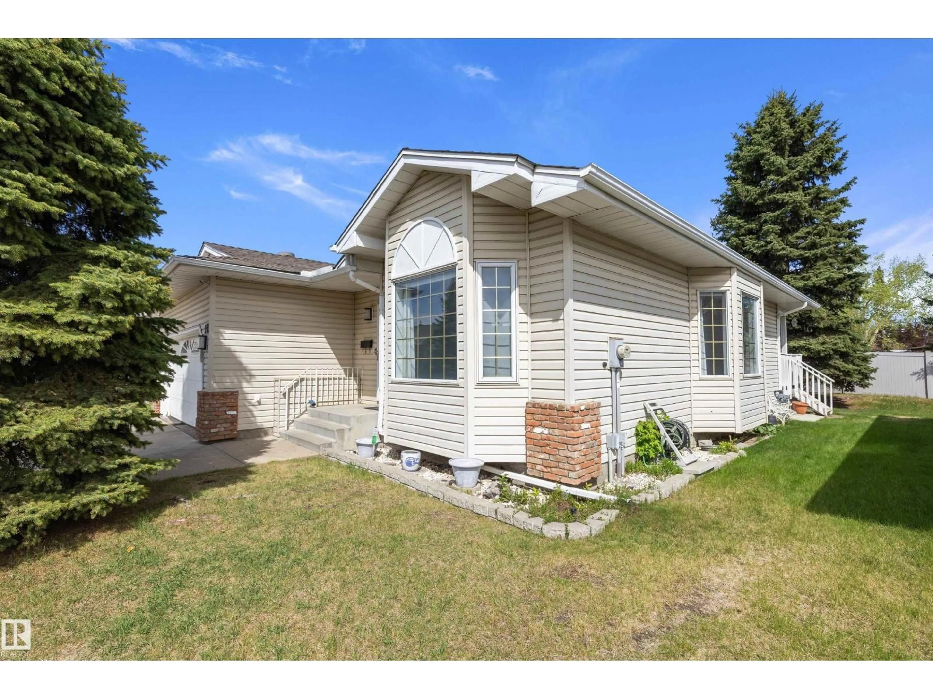 Home with vinyl exterior material, street for NW - 933 YOUVILLE DR W, Edmonton Alberta T6L6T2