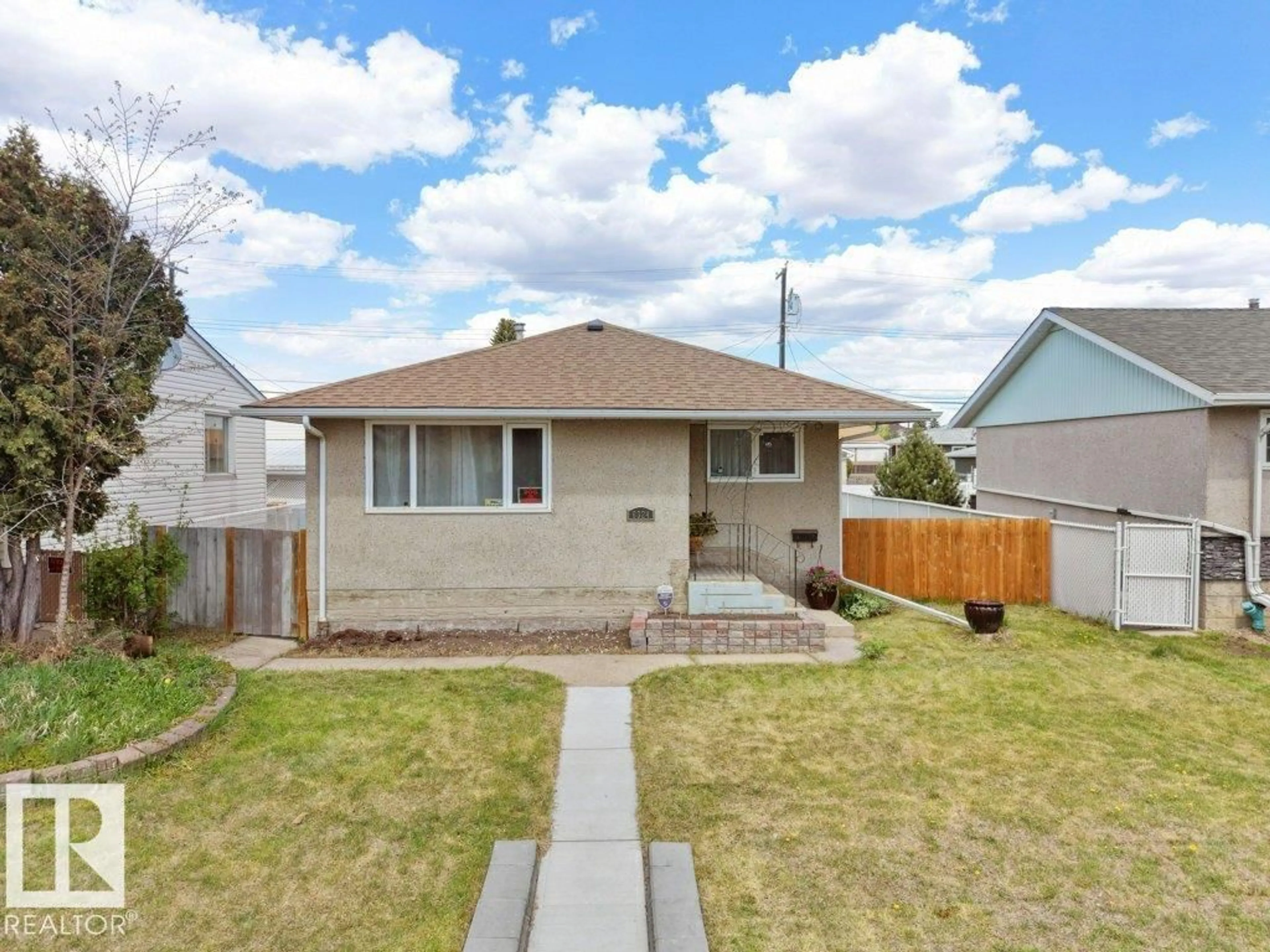 Home with vinyl exterior material, street for 6324 132 AV, Edmonton Alberta T5A0J7