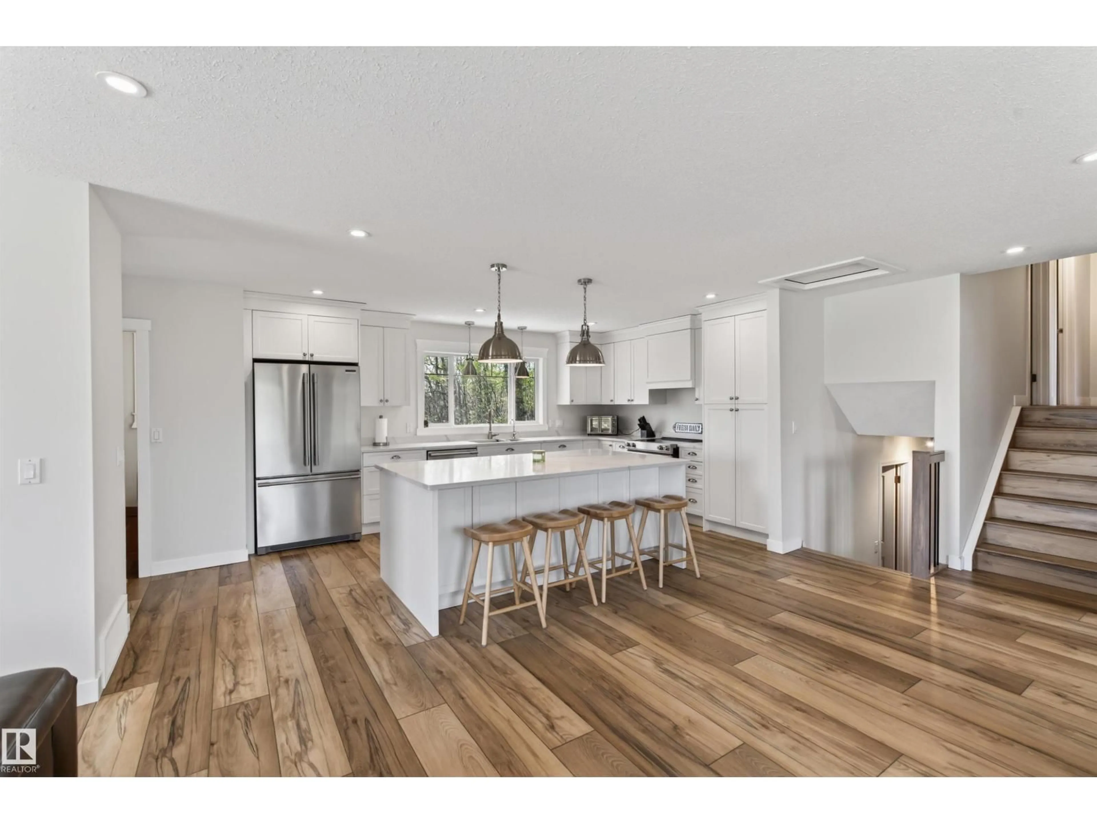 Open concept kitchen, wood/laminate floor for 60119 RR 473, Rural Bonnyville M.D. Alberta T9N0H1