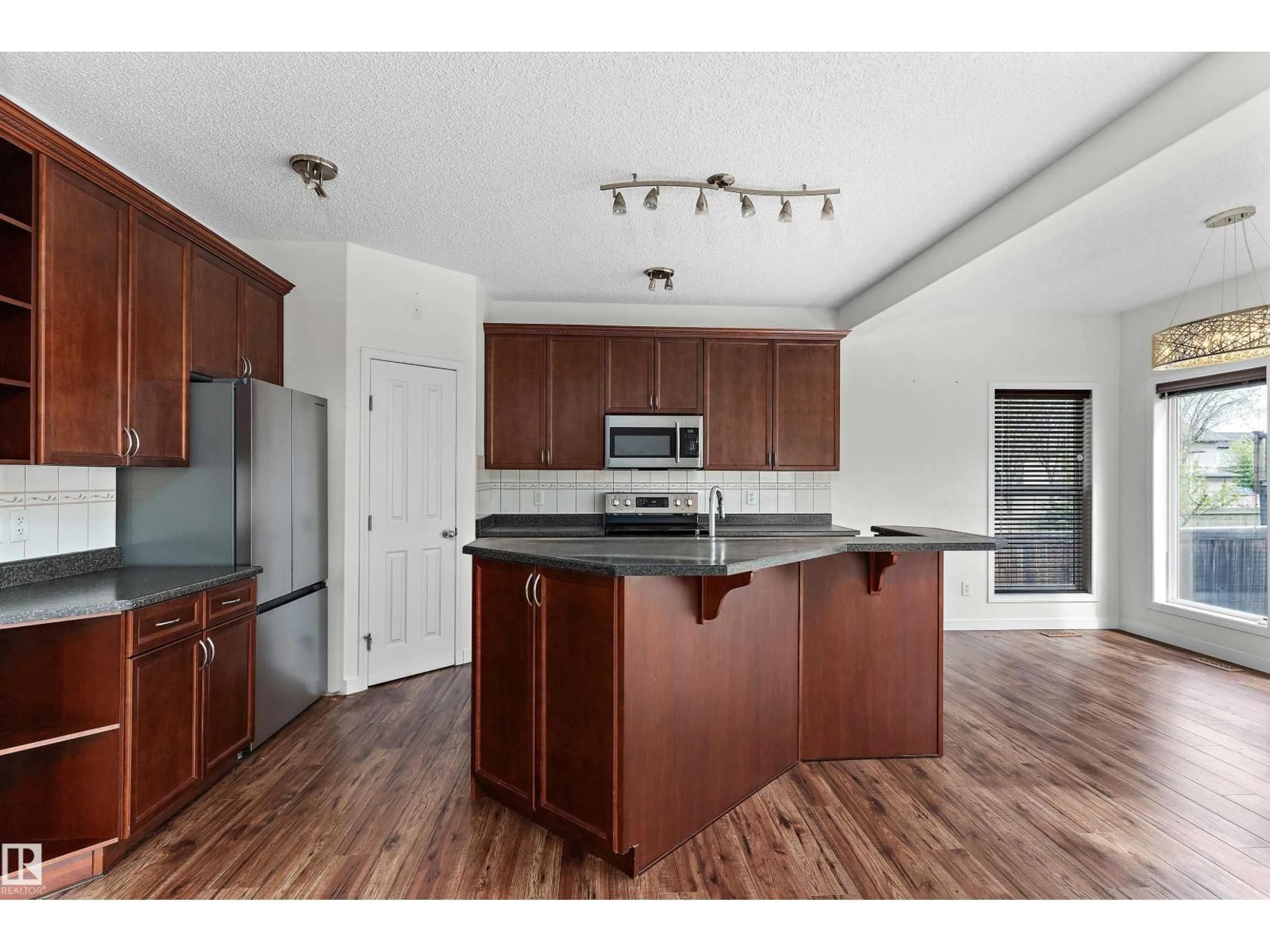 Open concept kitchen, wood/laminate floor for 583 LEGER WY, Edmonton Alberta T6R3T5