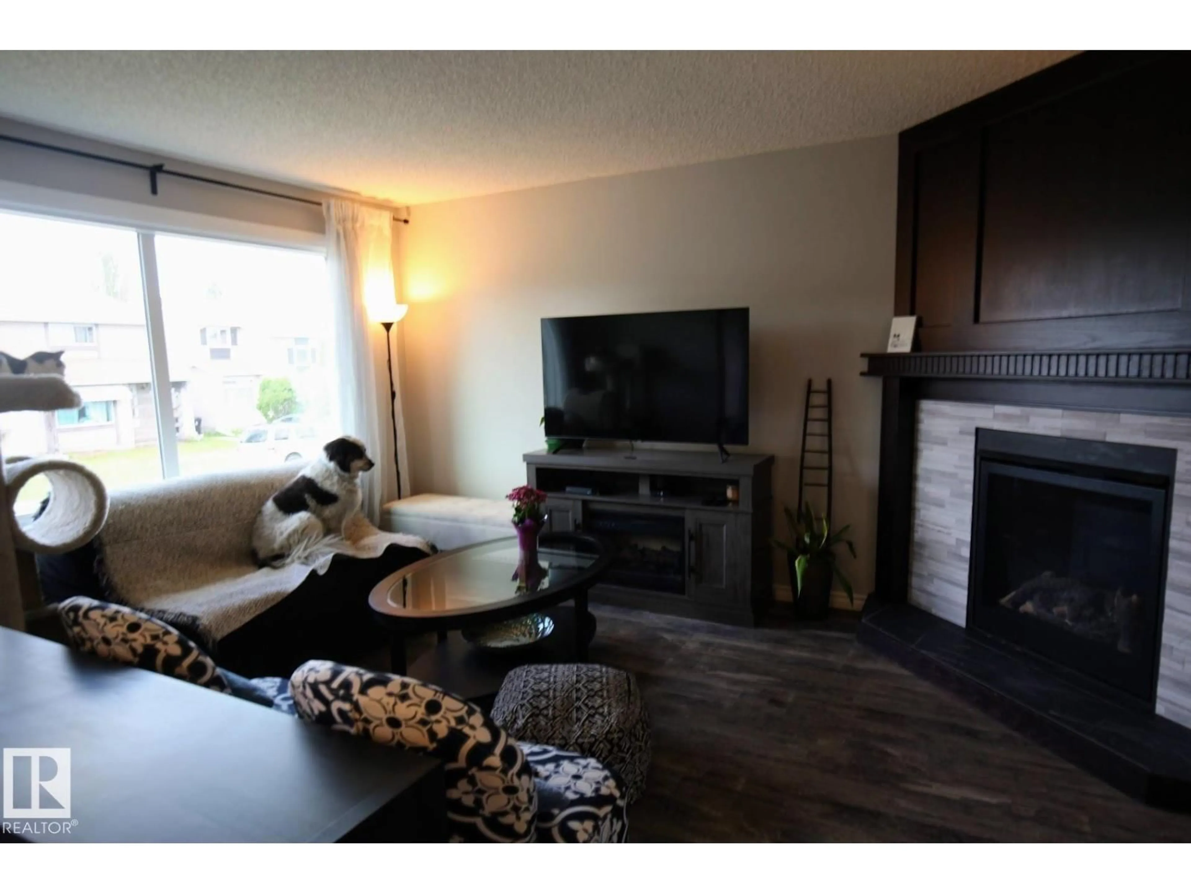 Living room with furniture, wood/laminate floor for 44 WELLINGTON CR, Spruce Grove Alberta T7X1K2