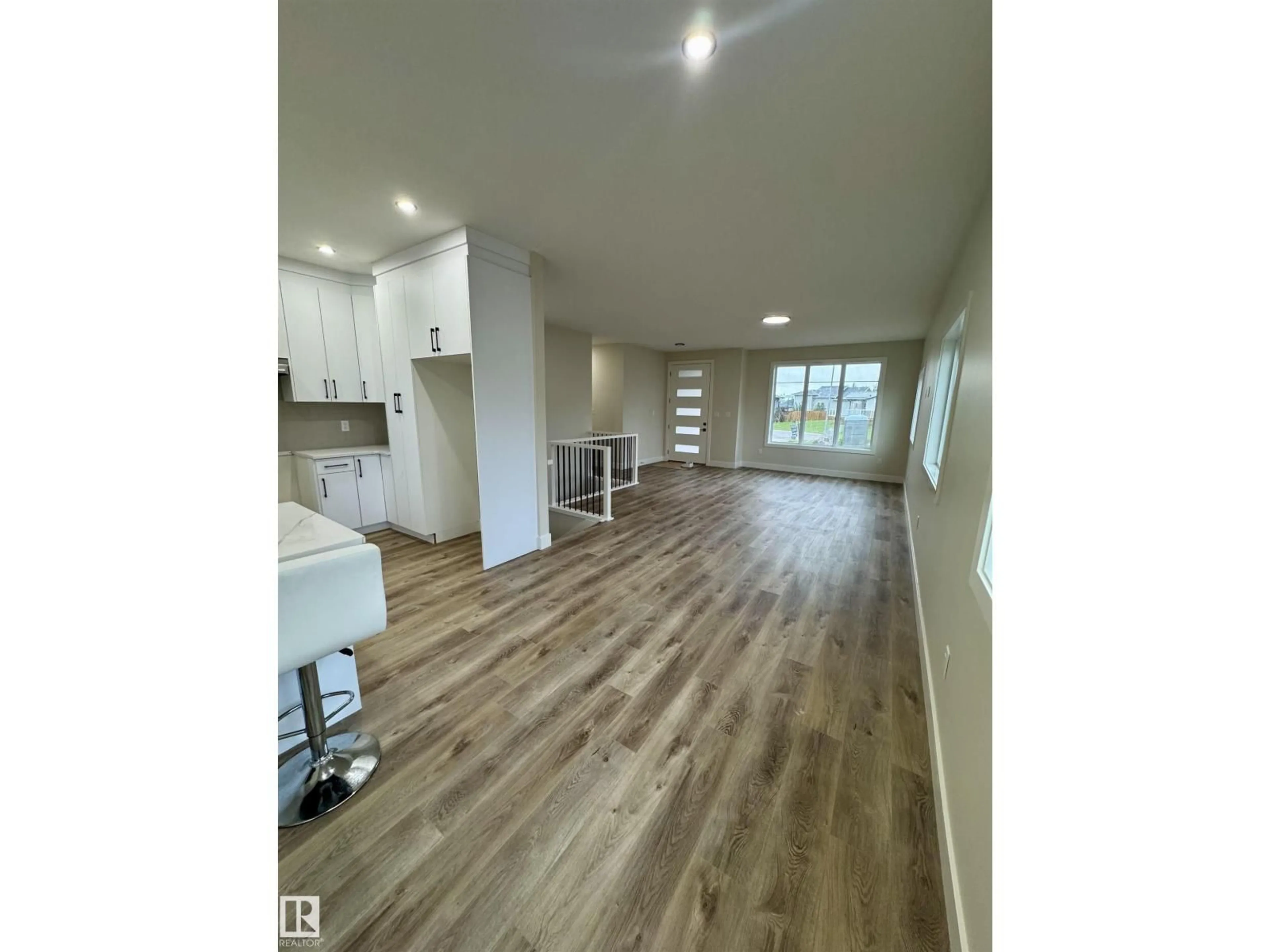 Open concept kitchen, wood/laminate floor for 5611 45 ST, Smoky Lake Town Alberta T0A3C0