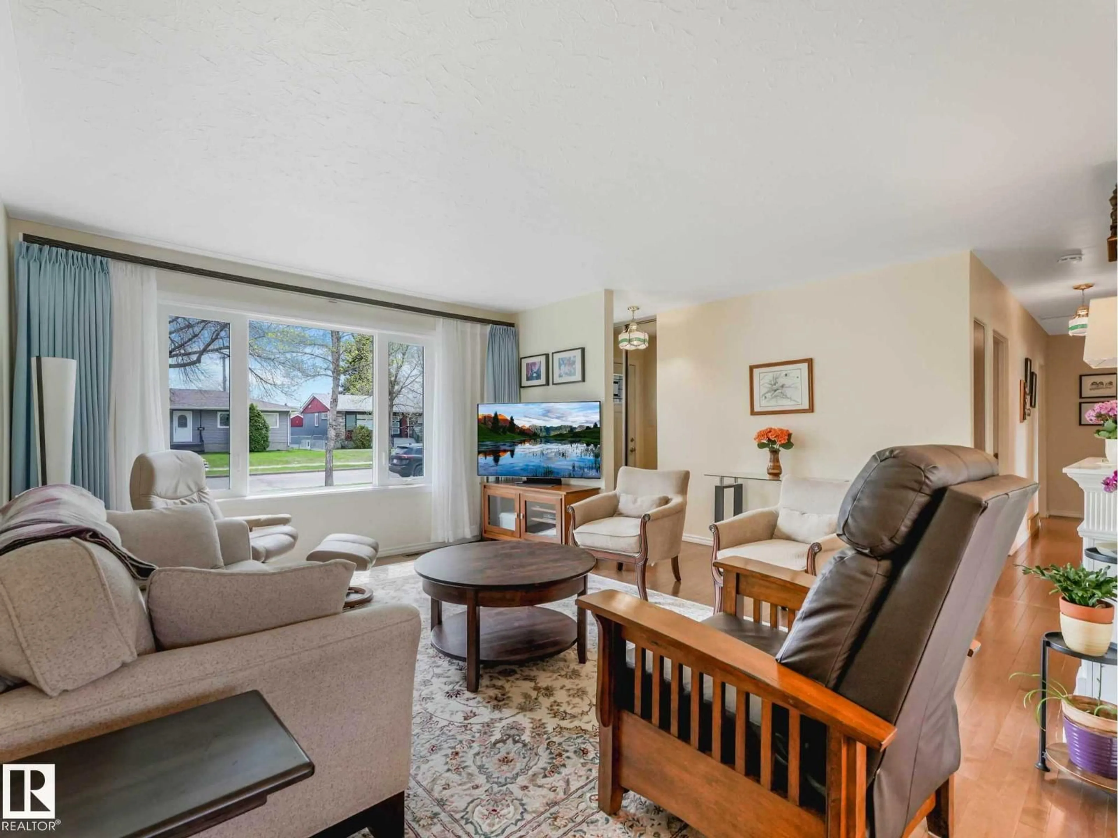 Living room with furniture, unknown for 7508 76 AV, Edmonton Alberta T6C0H4