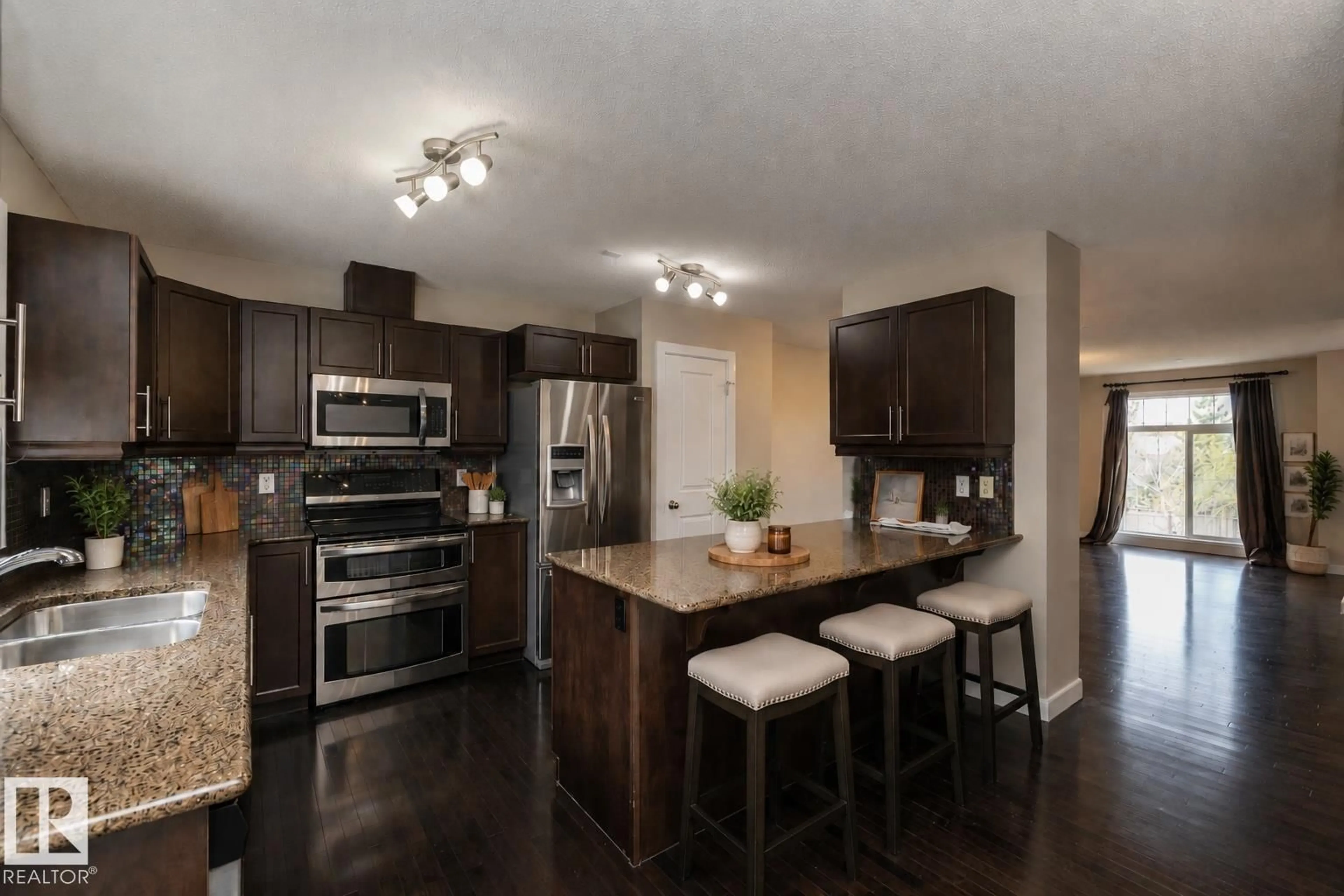 Open concept kitchen, wood/laminate floor for 117 CALLAGHAN DR, Edmonton Alberta T6W0J8