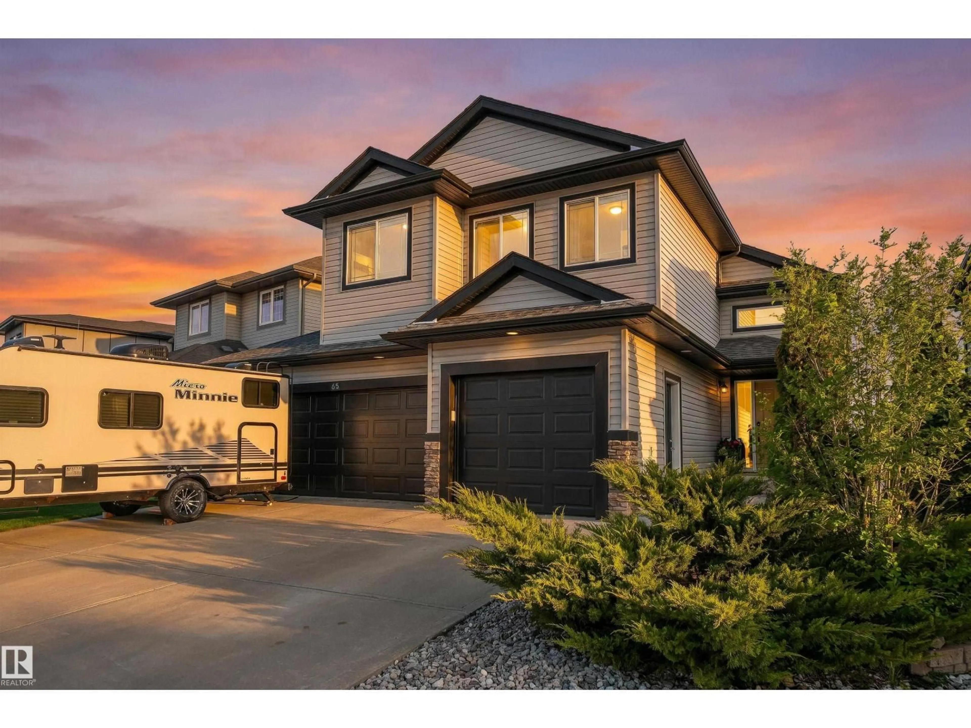Home with vinyl exterior material, street for 65 LAKEWOOD BV, Beaumont Alberta T4X0B5