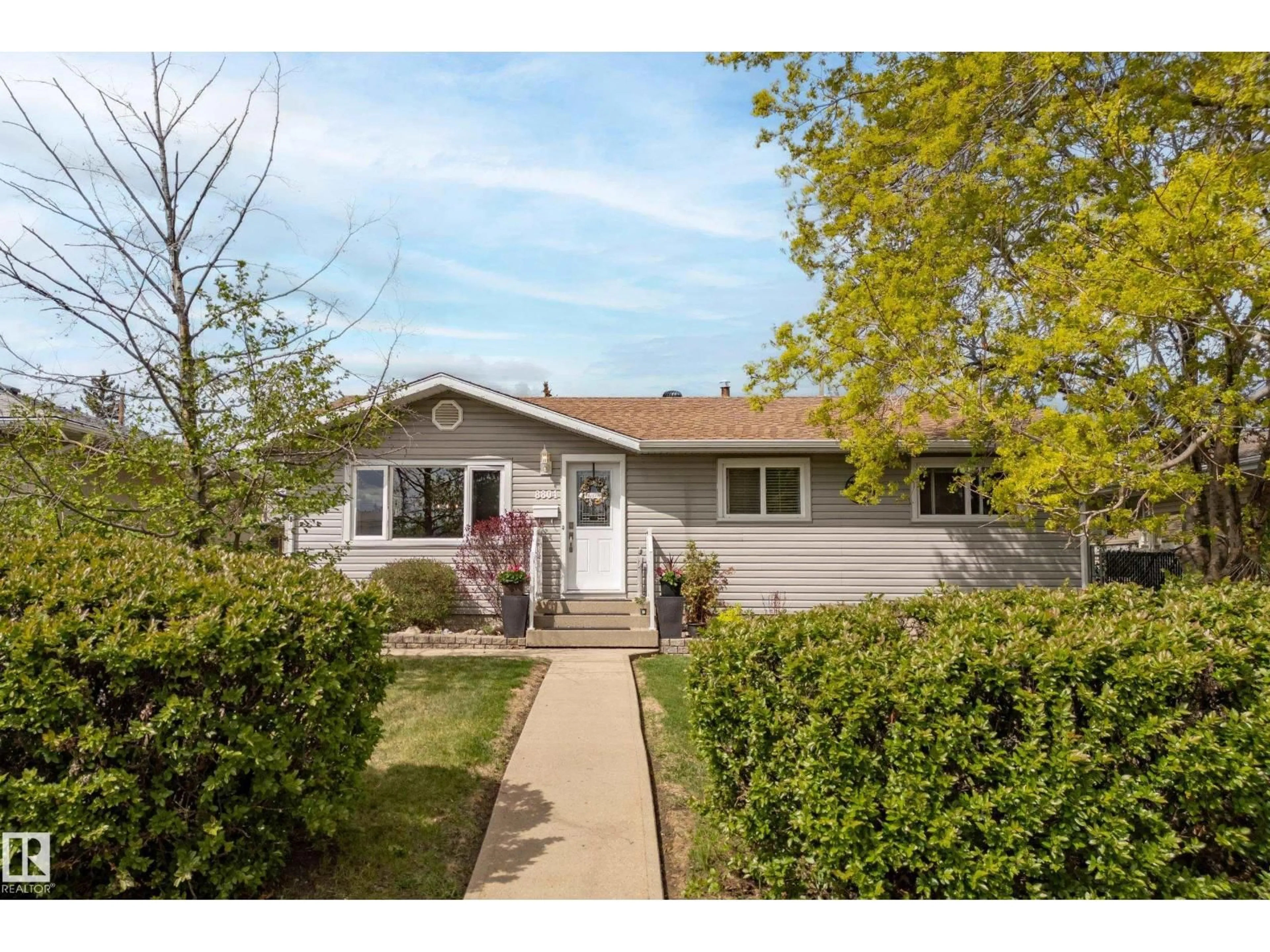 Home with vinyl exterior material, street for NW - 8804 136 AV, Edmonton Alberta T5E1V4