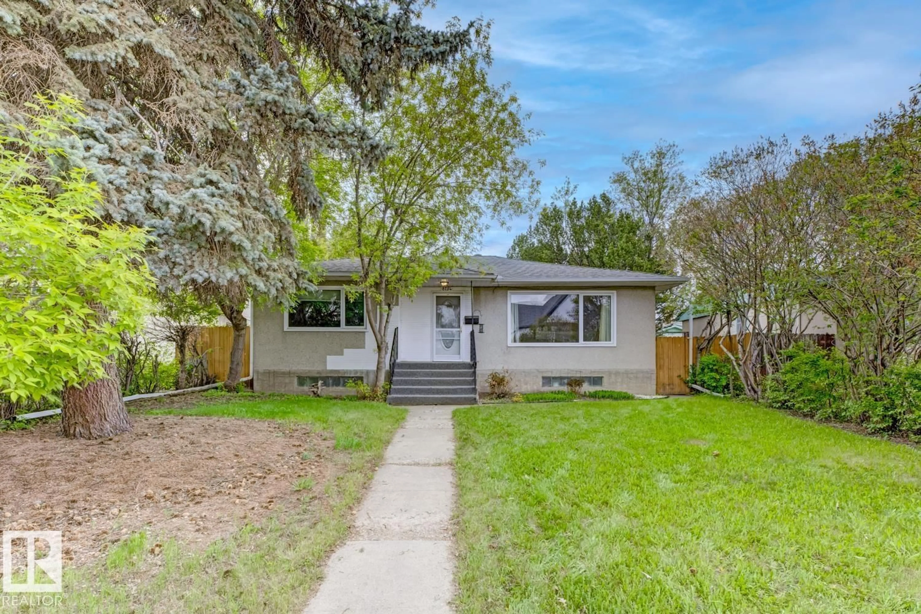 Home with vinyl exterior material, street for 8754 STRATHEARN DR, Edmonton Alberta T6C5C7