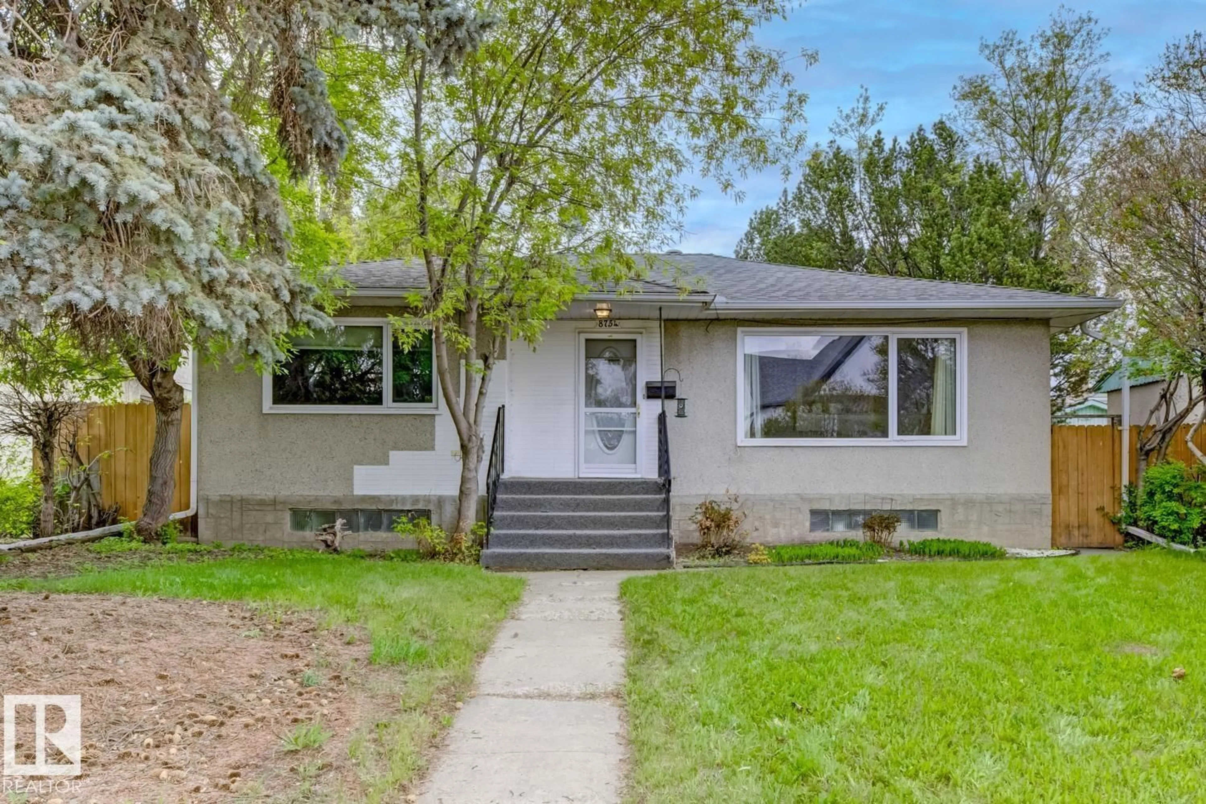 Home with vinyl exterior material, street for 8754 STRATHEARN DR, Edmonton Alberta T6C5C7
