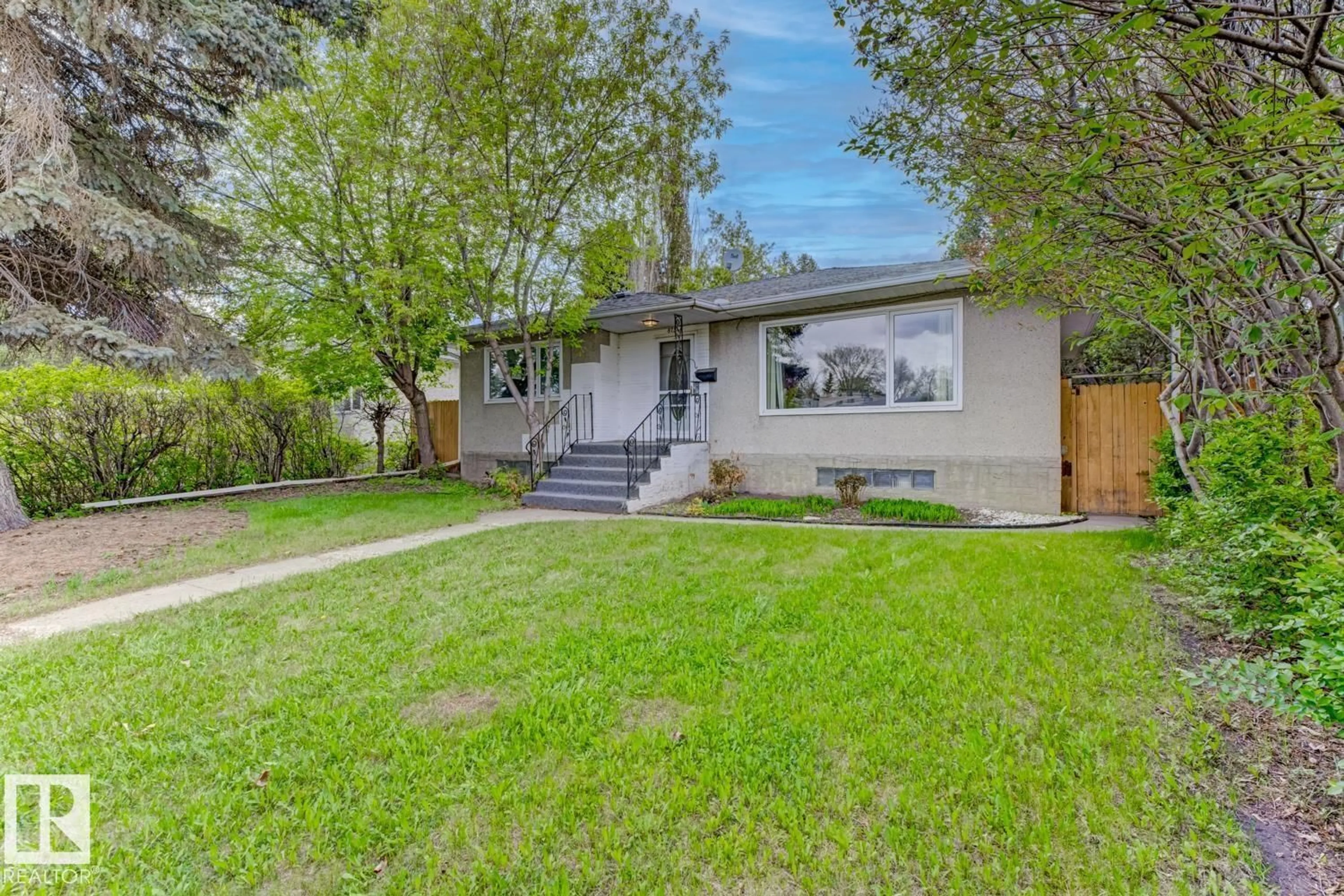 Home with vinyl exterior material, street for 8754 STRATHEARN DR, Edmonton Alberta T6C5C7