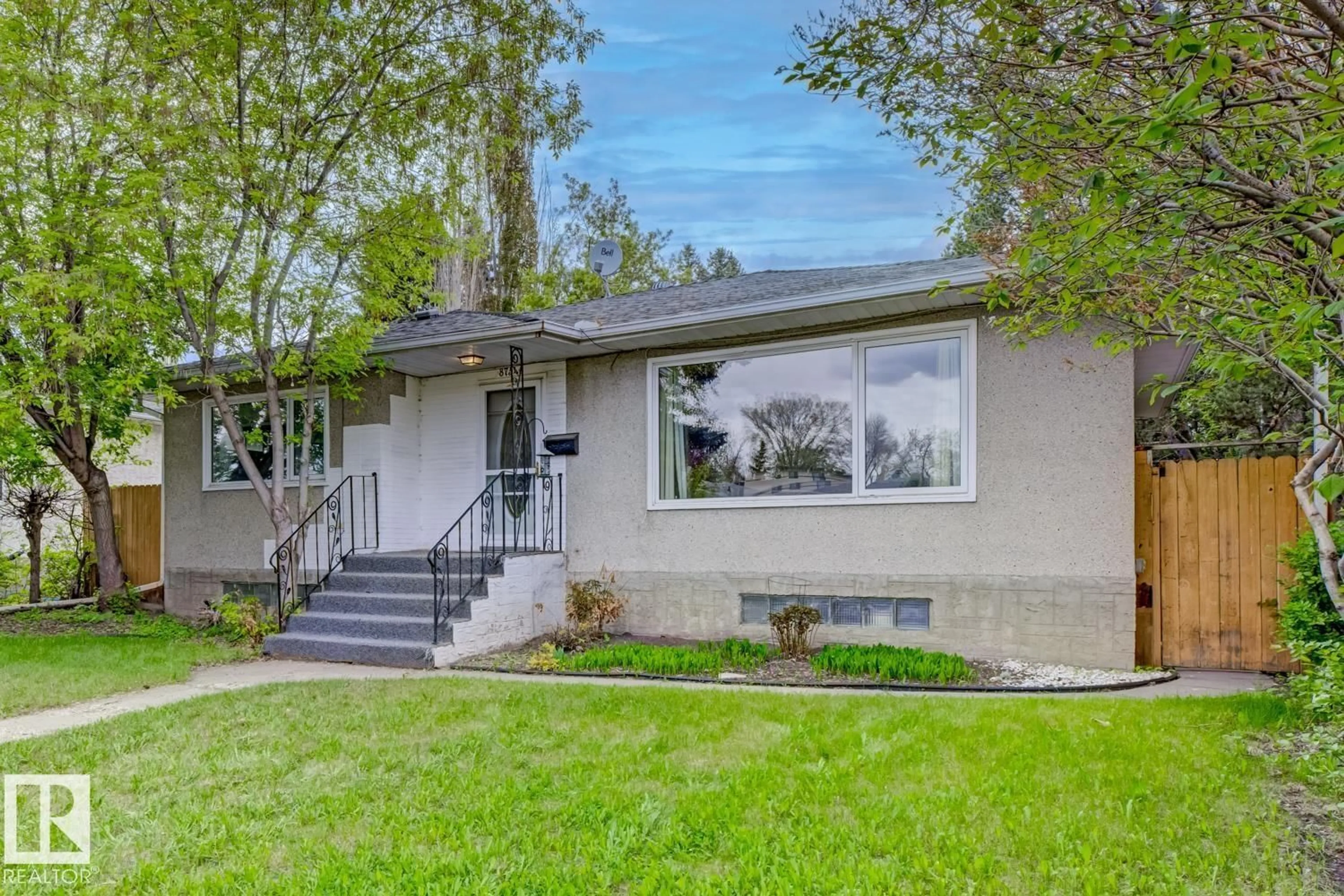 Home with vinyl exterior material, street for 8754 STRATHEARN DR, Edmonton Alberta T6C5C7