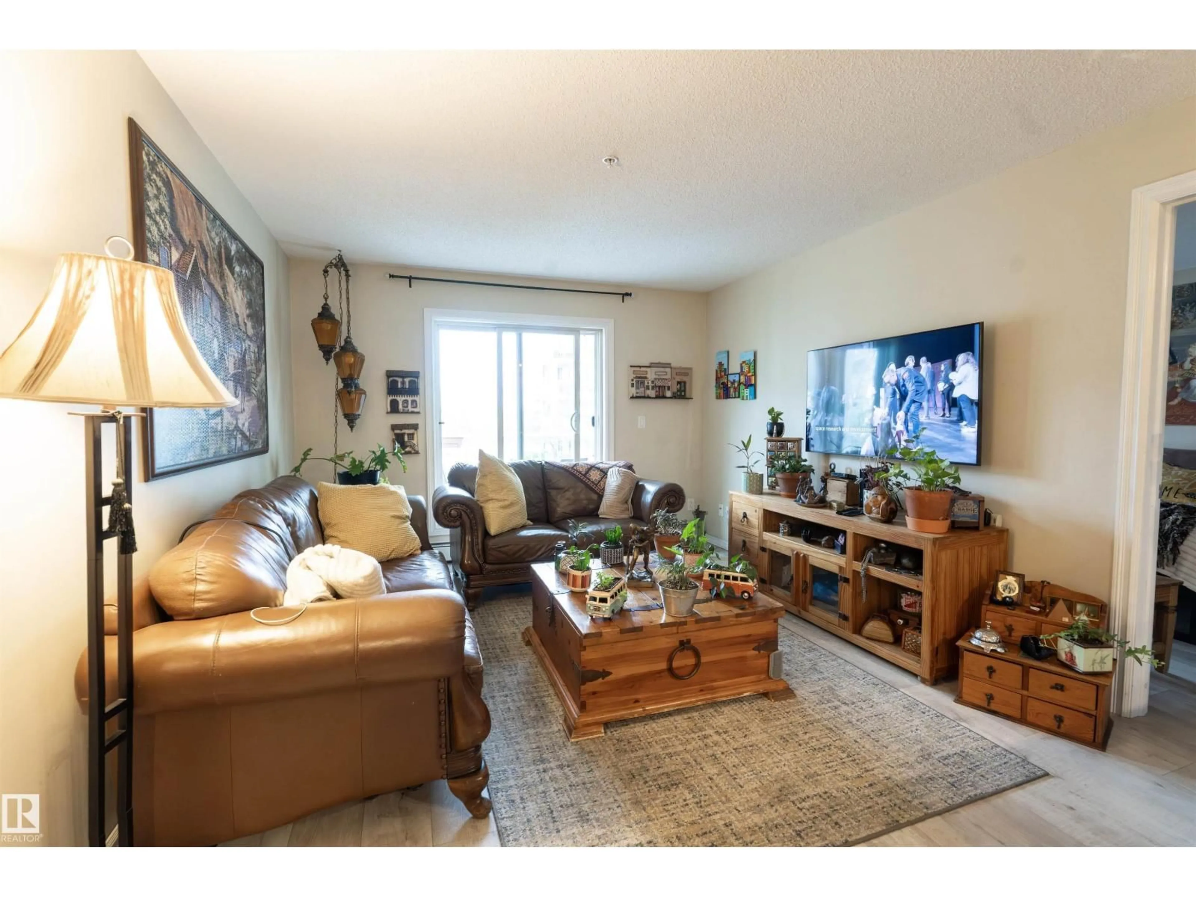 Living room with furniture, wood/laminate floor for #203 - 4403 23 ST, Edmonton Alberta T6T0E4