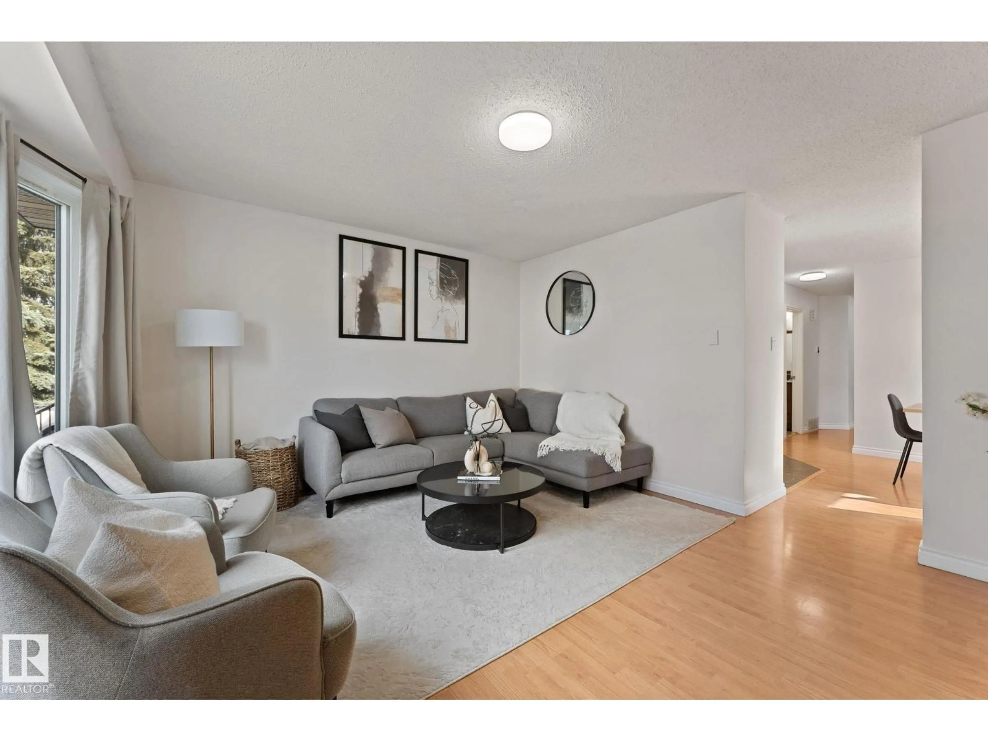 Living room with furniture, unknown for 4621 126 AV, Edmonton Alberta T5A4L1