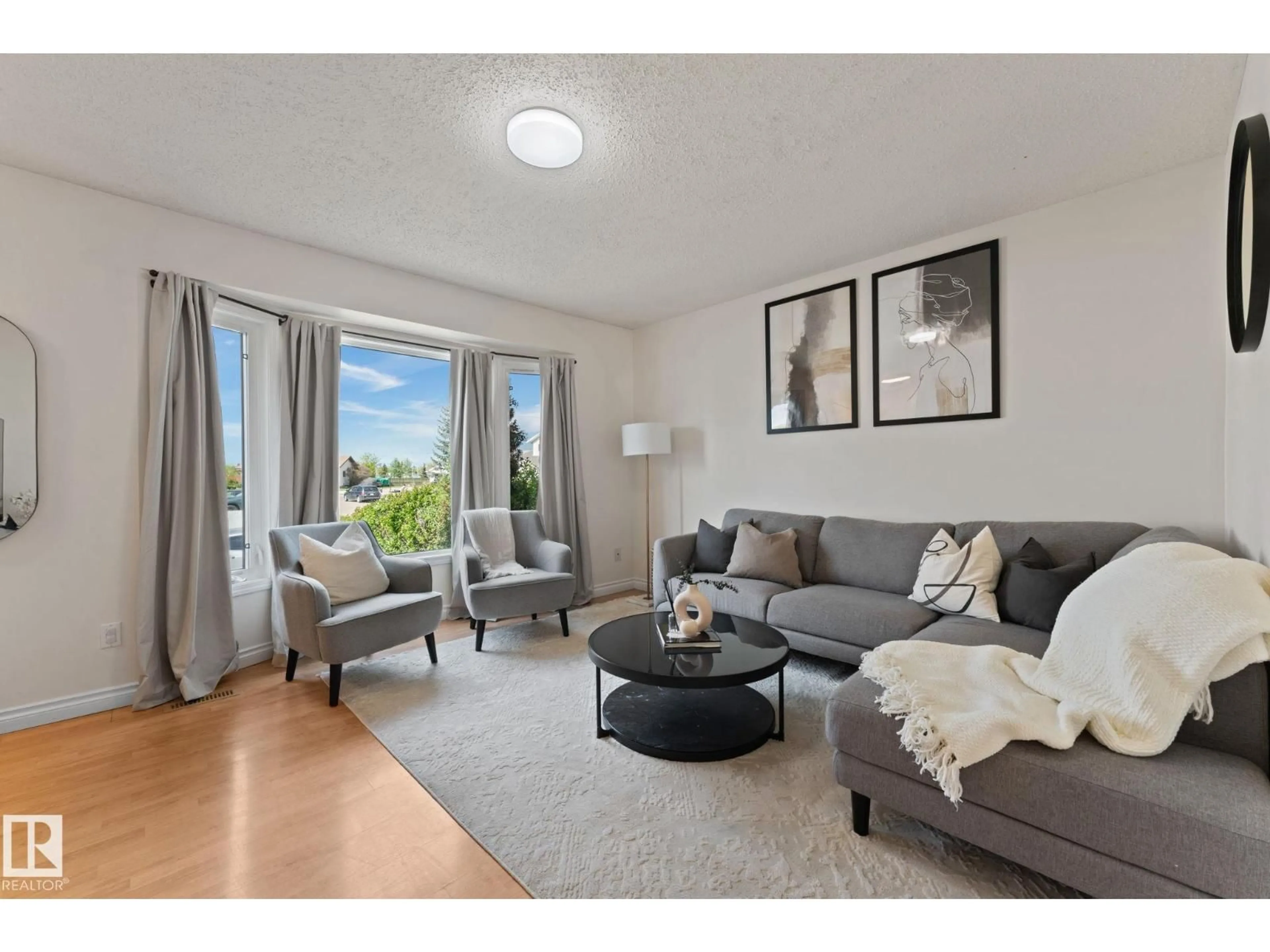 Living room with furniture, unknown for 4621 126 AV, Edmonton Alberta T5A4L1