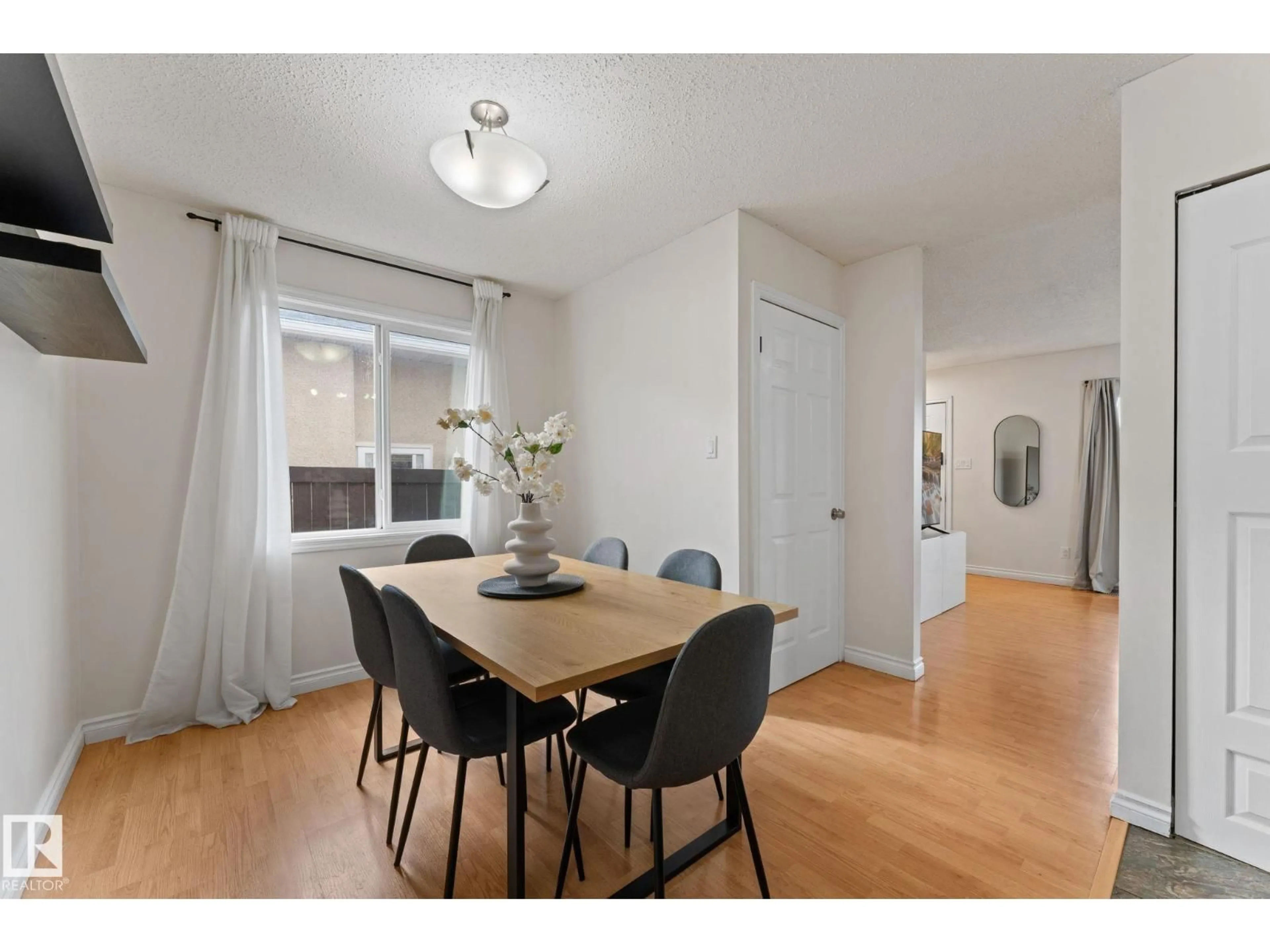 Dining room, wood/laminate floor for 4621 126 AV, Edmonton Alberta T5A4L1