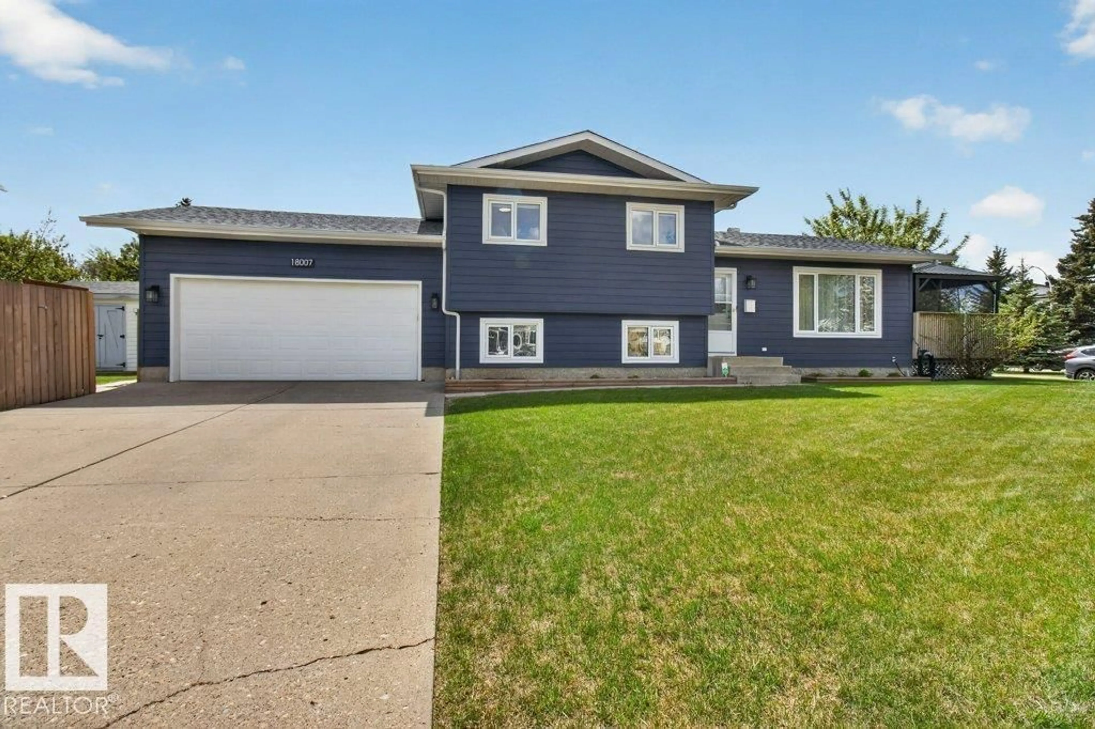 Home with vinyl exterior material, street for 18007 99A AV NW, Edmonton Alberta T5T4B9