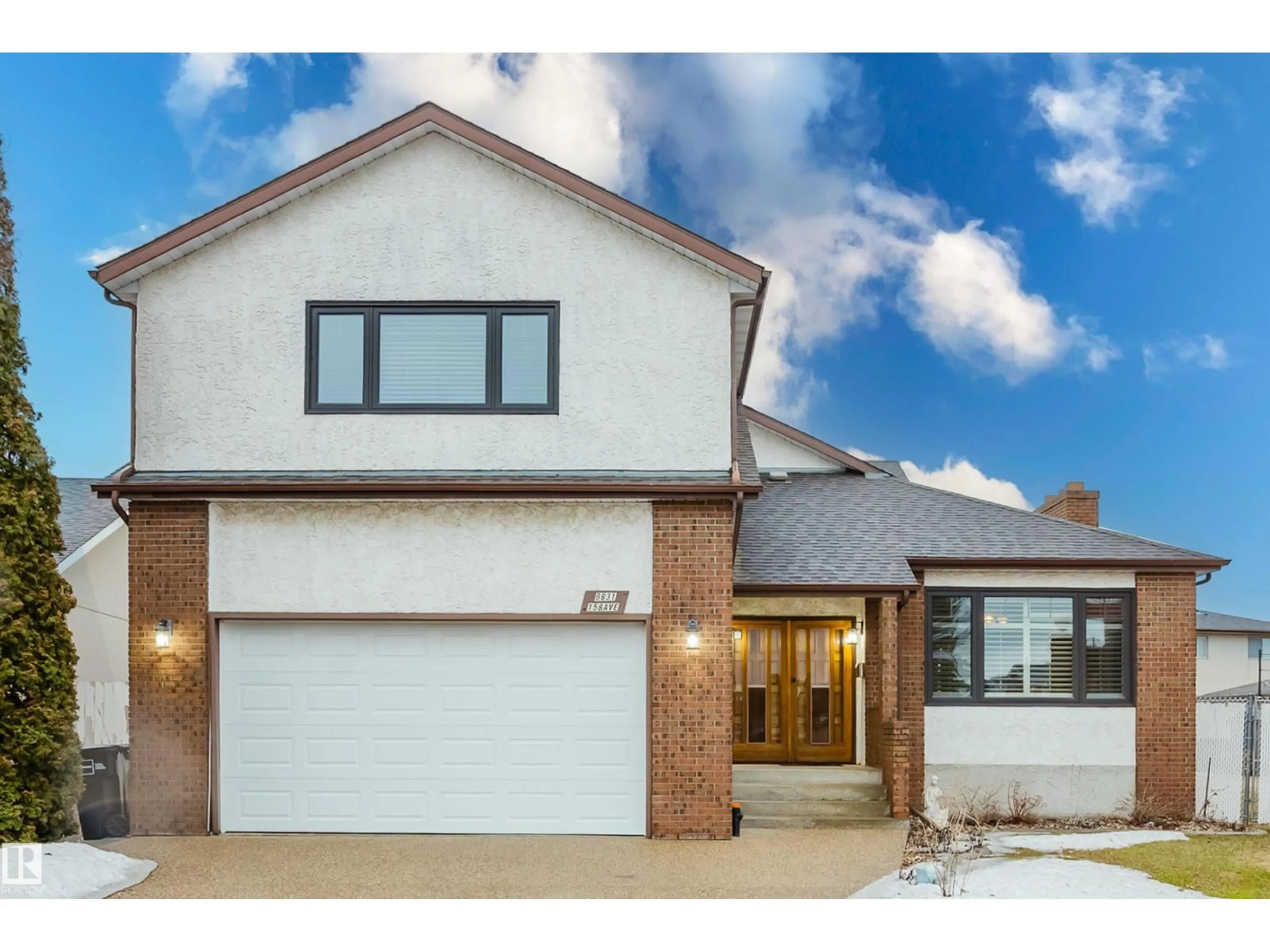 Home with brick exterior material, street for 9831 158 AV NW, Edmonton Alberta T5X4V3