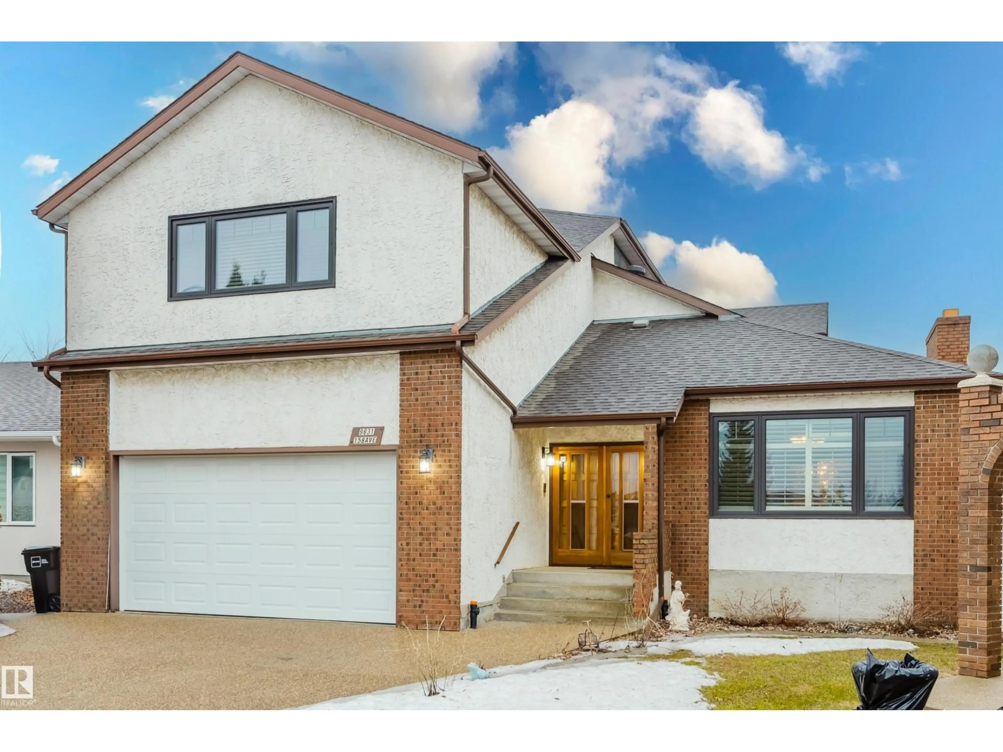 Home with brick exterior material, street for 9831 158 AV NW, Edmonton Alberta T5X4V3