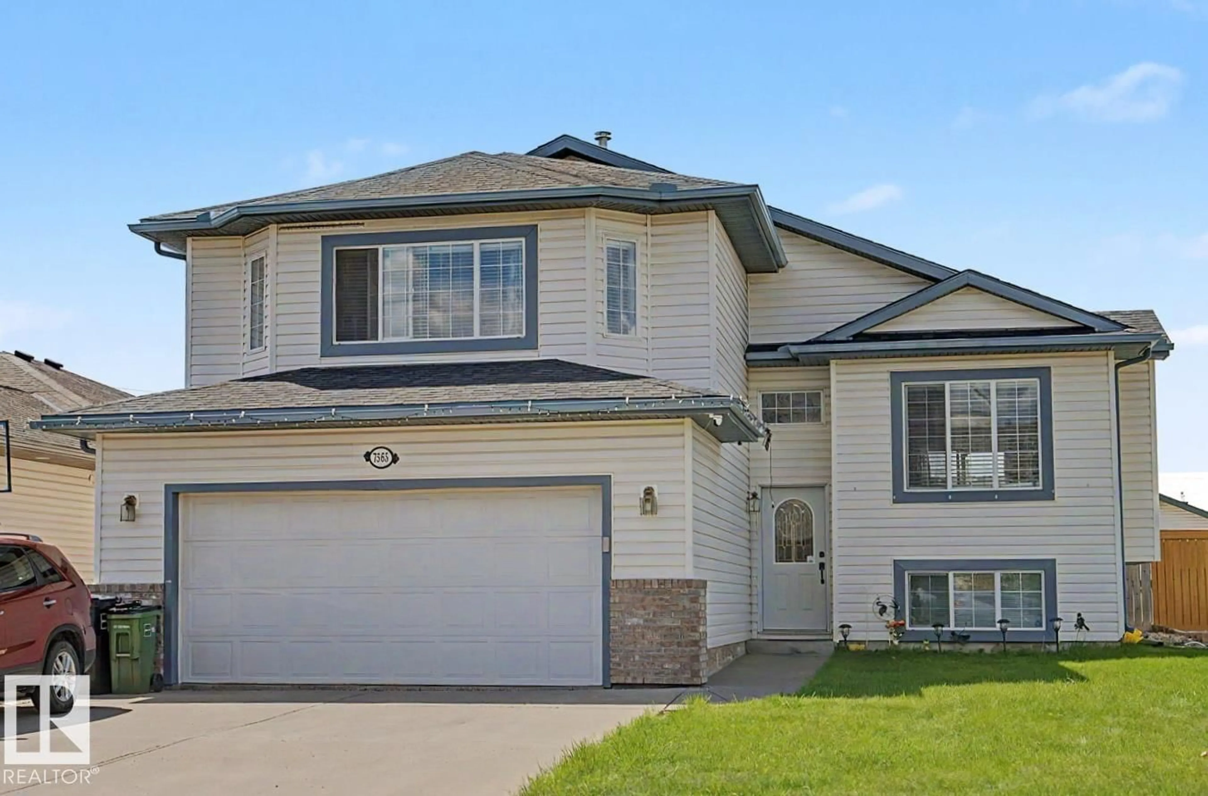 Home with vinyl exterior material, street for 7565 165A AV, Edmonton Alberta T5Z3P9