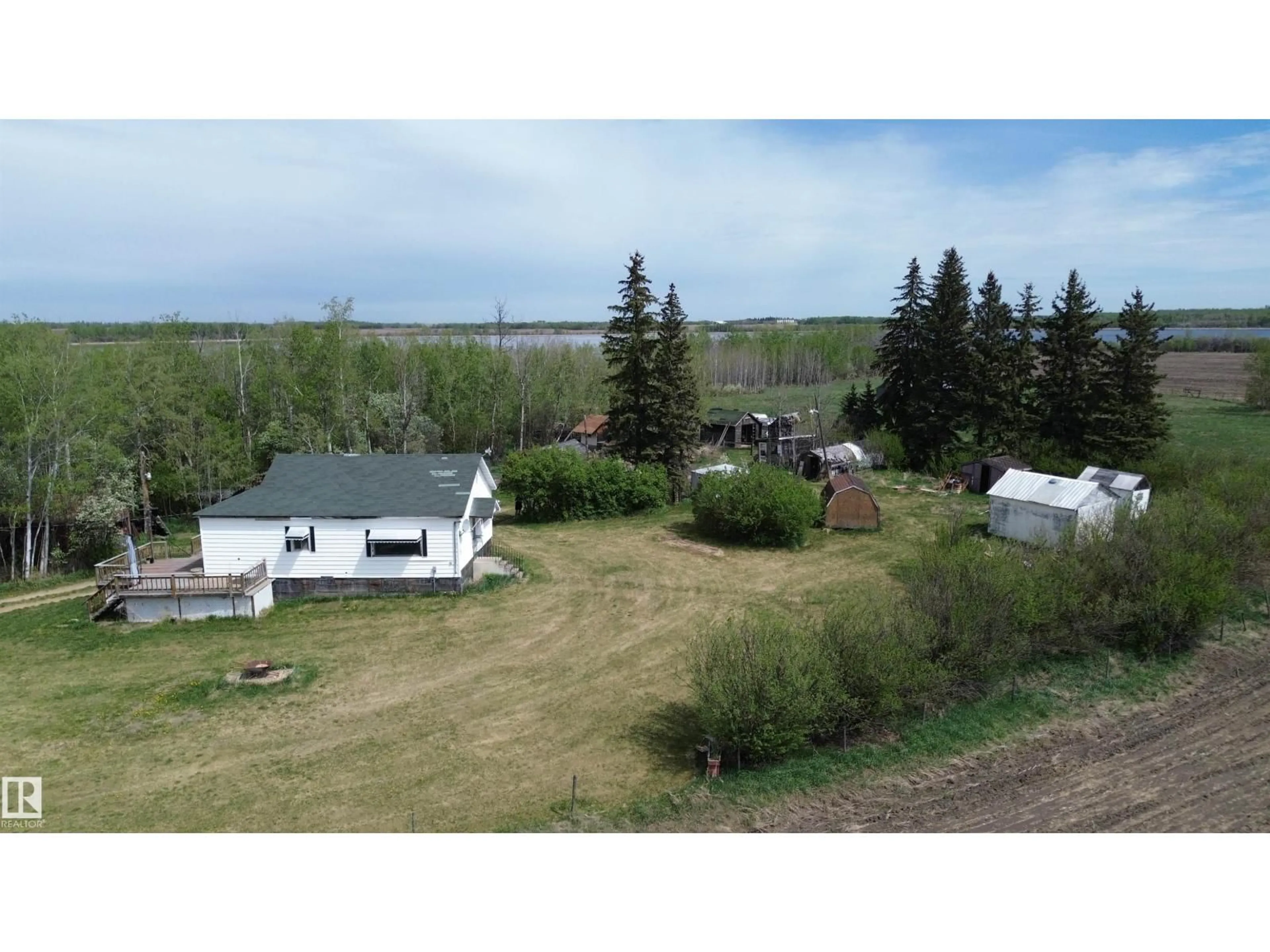 A pic from outside/outdoor area/front of a property/back of a property/a pic from drone, unknown for 1209 TWP RD 564, Rural Sturgeon County Alberta T8R0L1