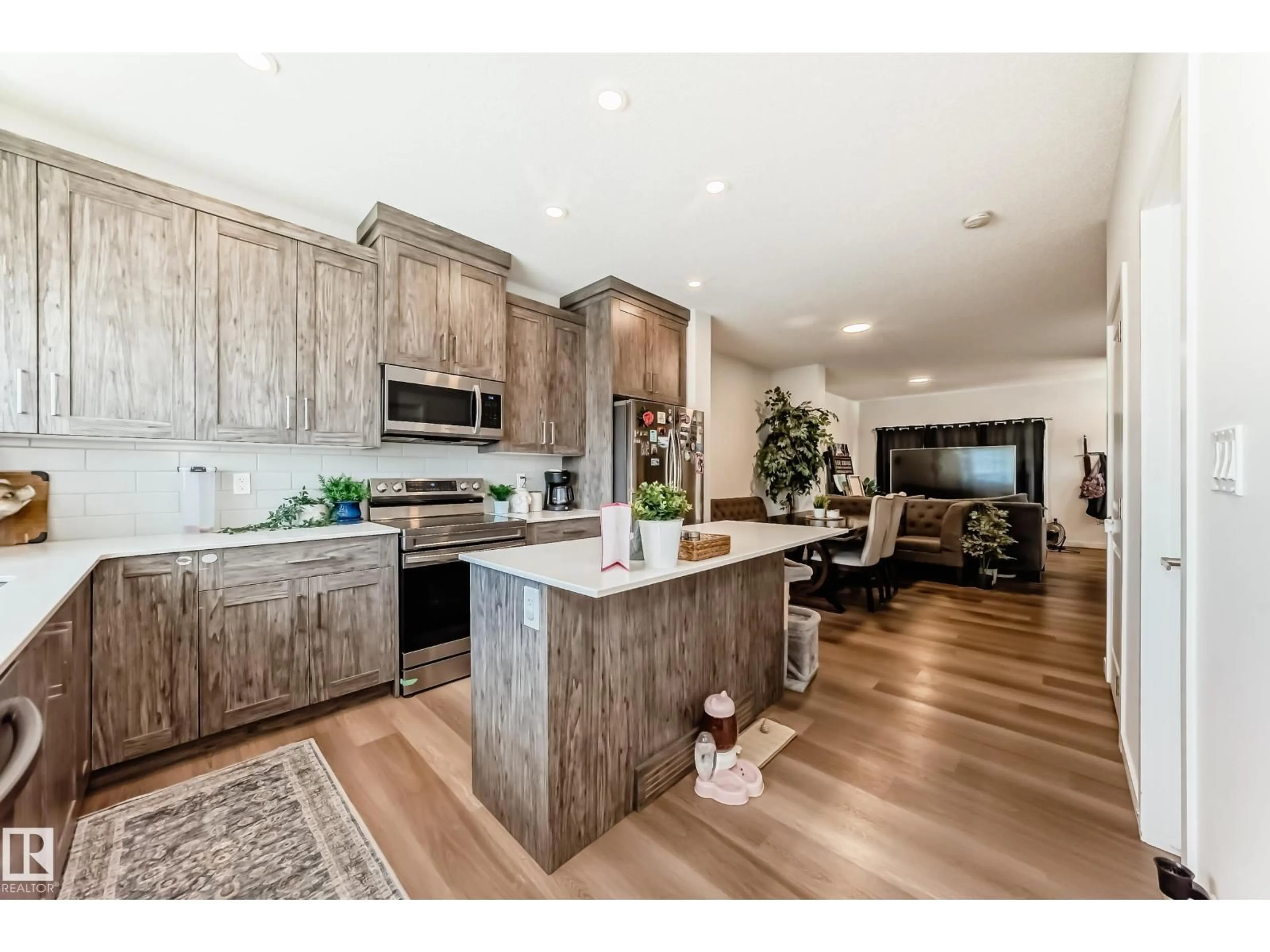 Open concept kitchen, wood/laminate floor for 5165 EDGEMONT BV, Edmonton Alberta T6M1J7