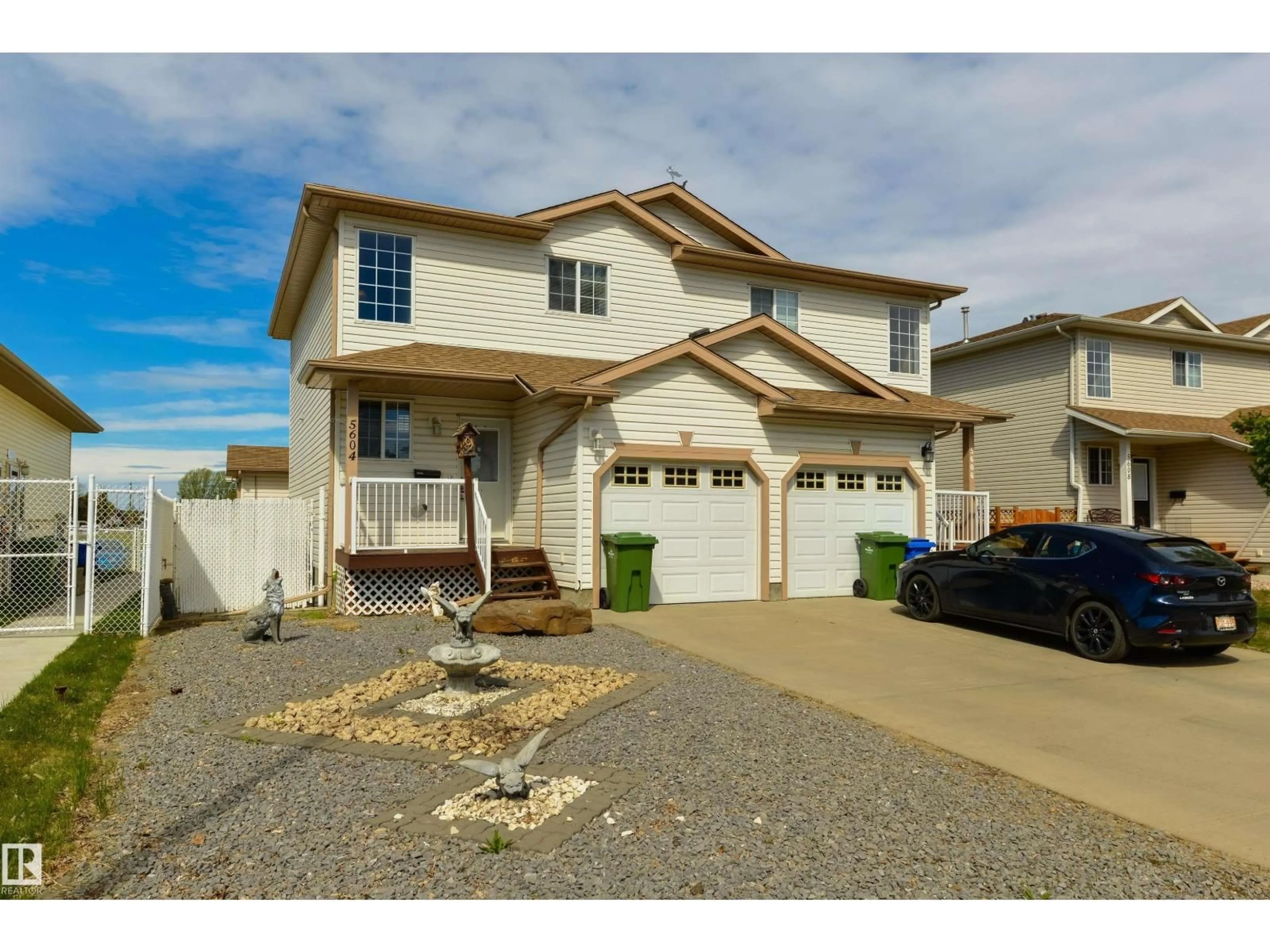 Home with vinyl exterior material, street for 5604 GARDEN MEADOWS DR, Wetaskiwin Alberta T9A3S5