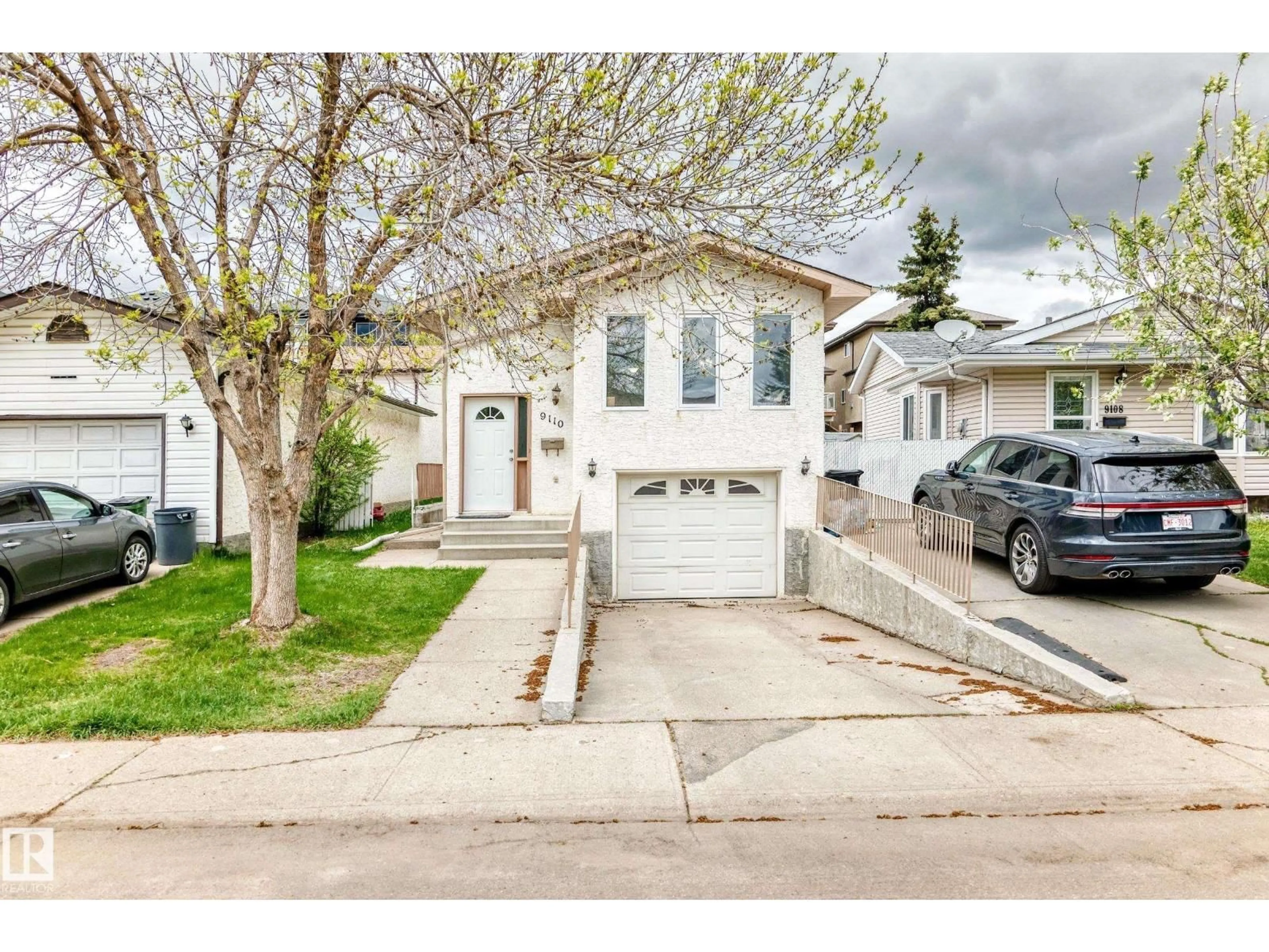 Home with vinyl exterior material, street for 9110 180A AV, Edmonton Alberta T5Z2K5