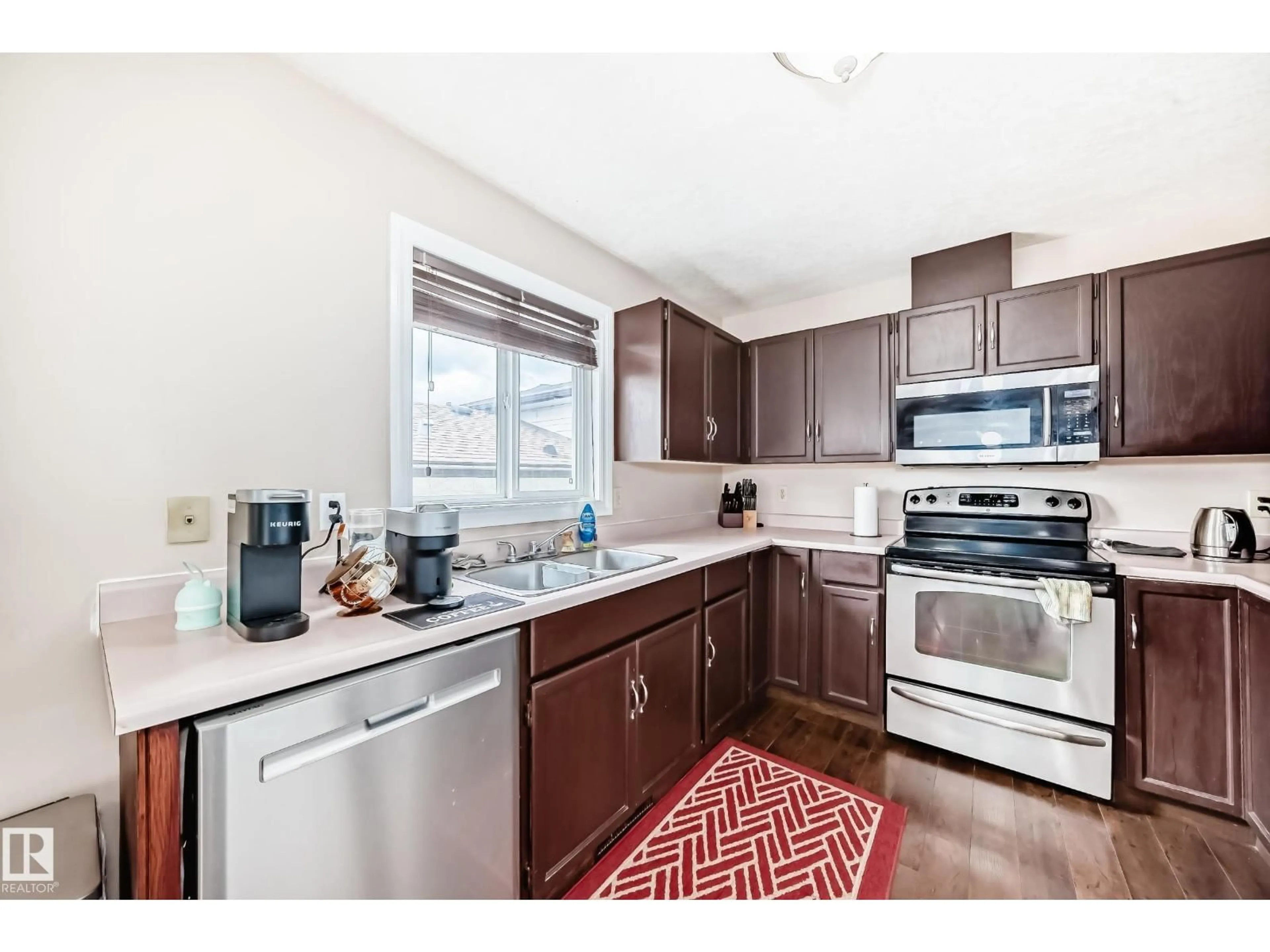 Open concept kitchen, unknown for 9110 180A AV, Edmonton Alberta T5Z2K5
