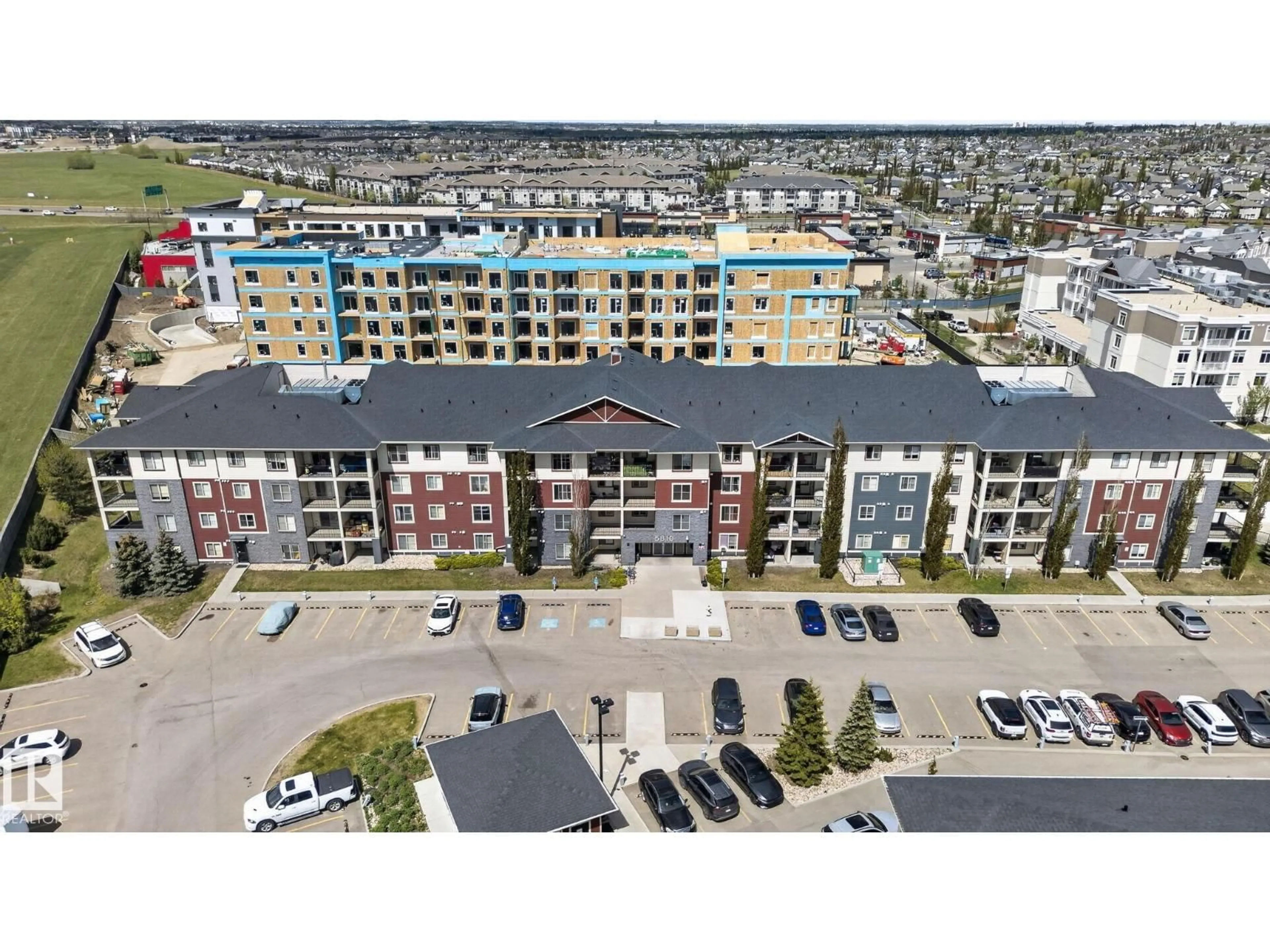 A pic from outside/outdoor area/front of a property/back of a property/a pic from drone, city buildings view from balcony for #318 - 5810 MULLEN PL, Edmonton Alberta T6R0W2