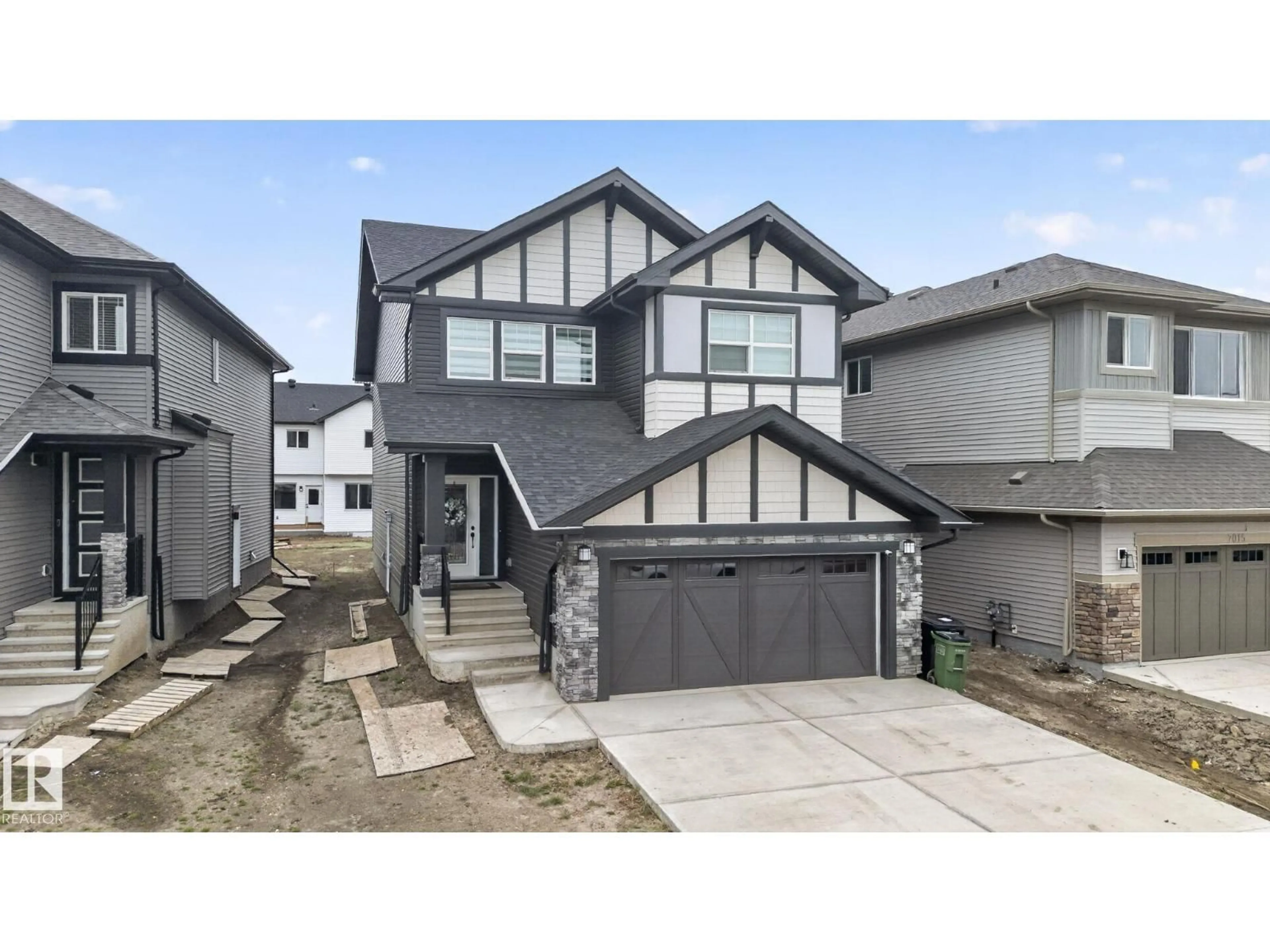 Home with vinyl exterior material, street for NW - 7011 177 AVENUE, Edmonton Alberta T5Z0W8