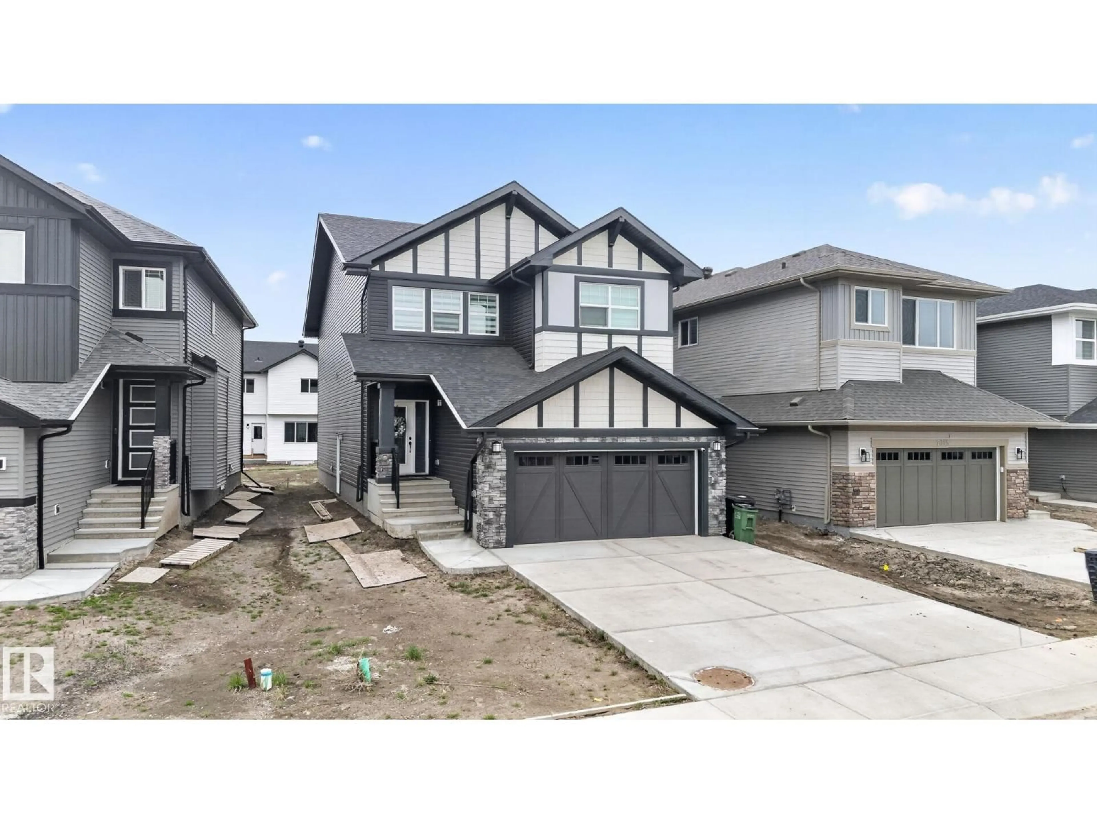 Home with vinyl exterior material, street for NW - 7011 177 AVENUE, Edmonton Alberta T5Z0W8