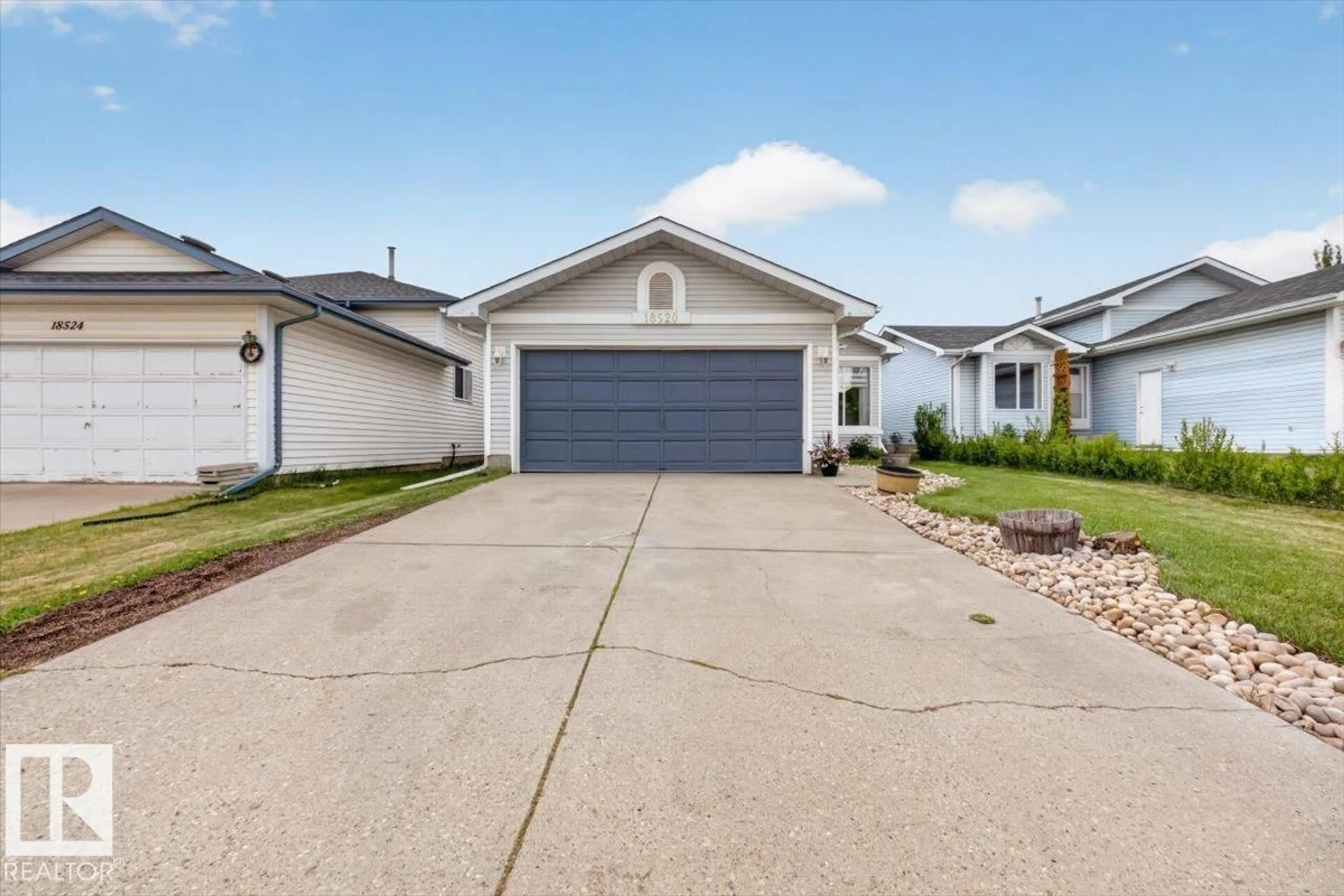 Home with vinyl exterior material, street for 18520 77 AV, Edmonton Alberta T5T5X3
