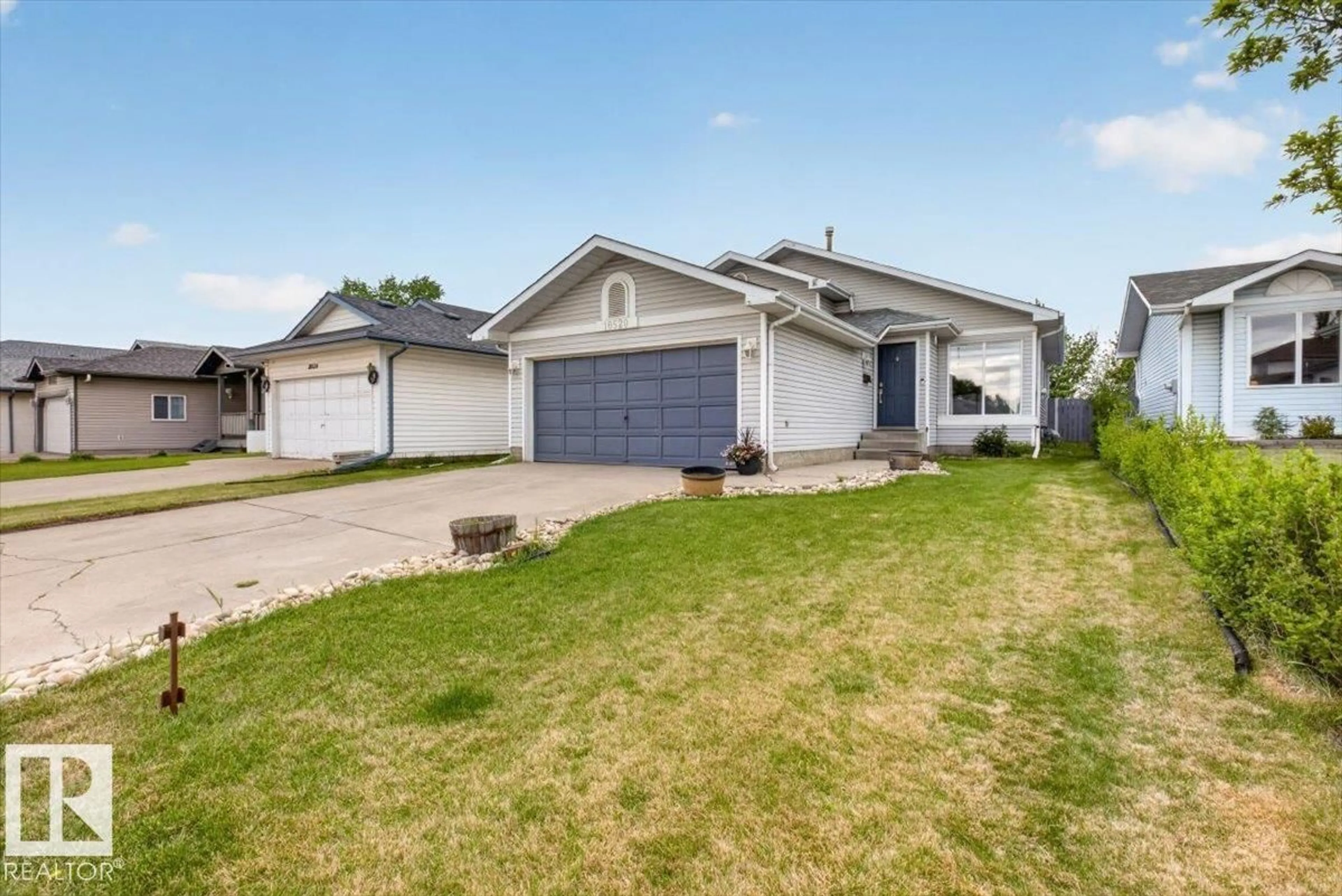 Home with vinyl exterior material, street for 18520 77 AV, Edmonton Alberta T5T5X3