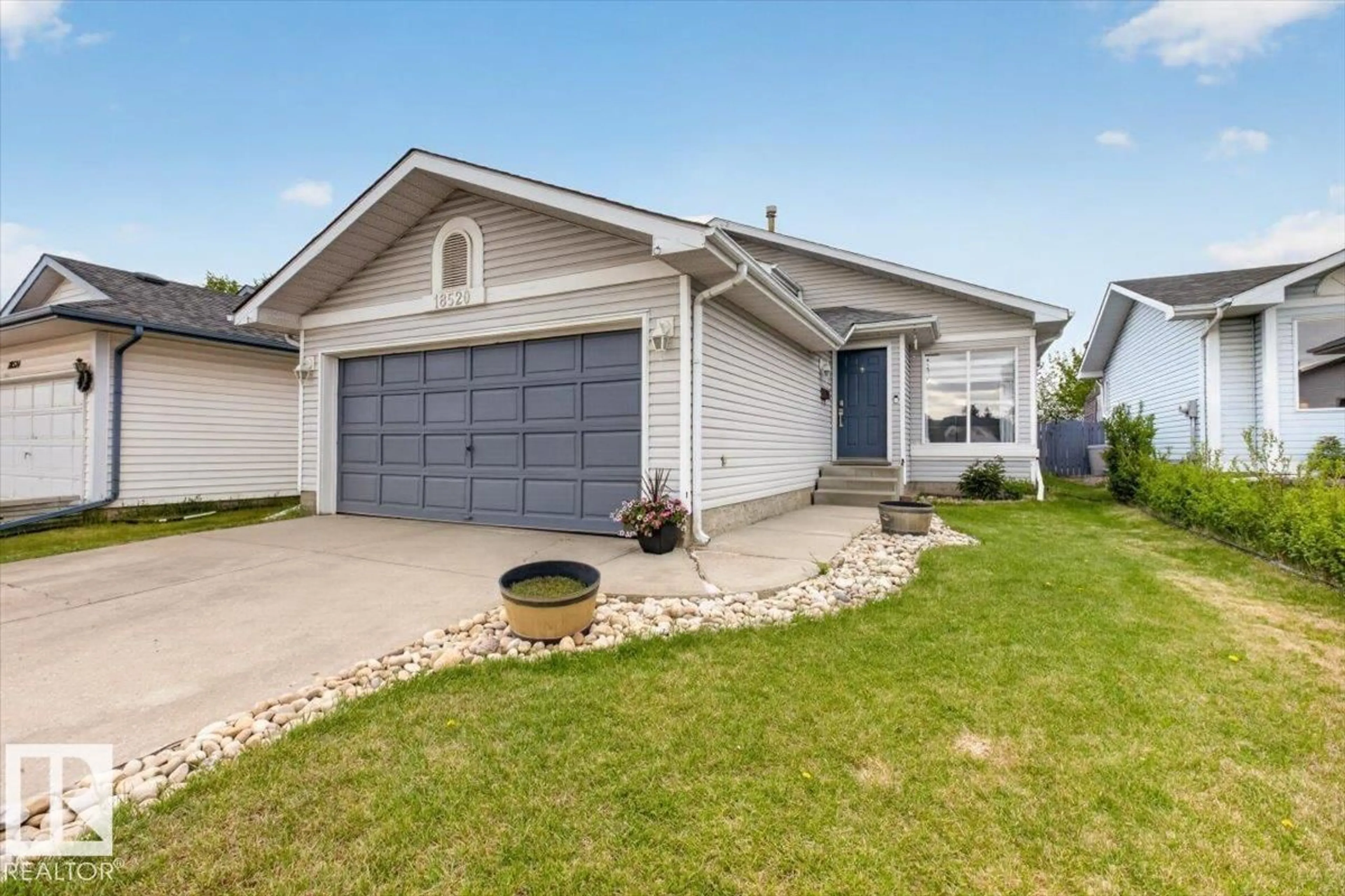 Home with vinyl exterior material, street for 18520 77 AV, Edmonton Alberta T5T5X3