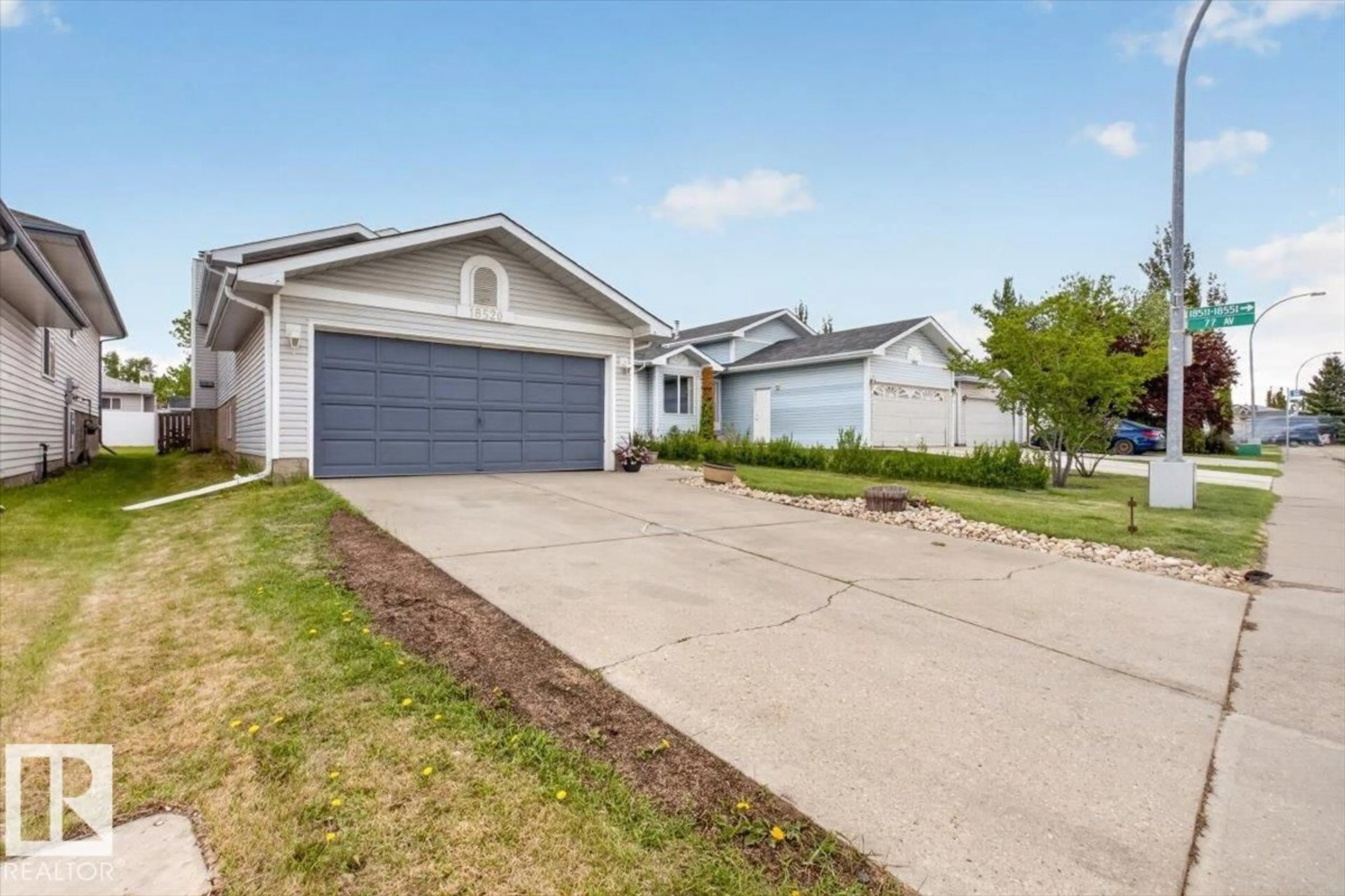 Home with vinyl exterior material, street for 18520 77 AV, Edmonton Alberta T5T5X3