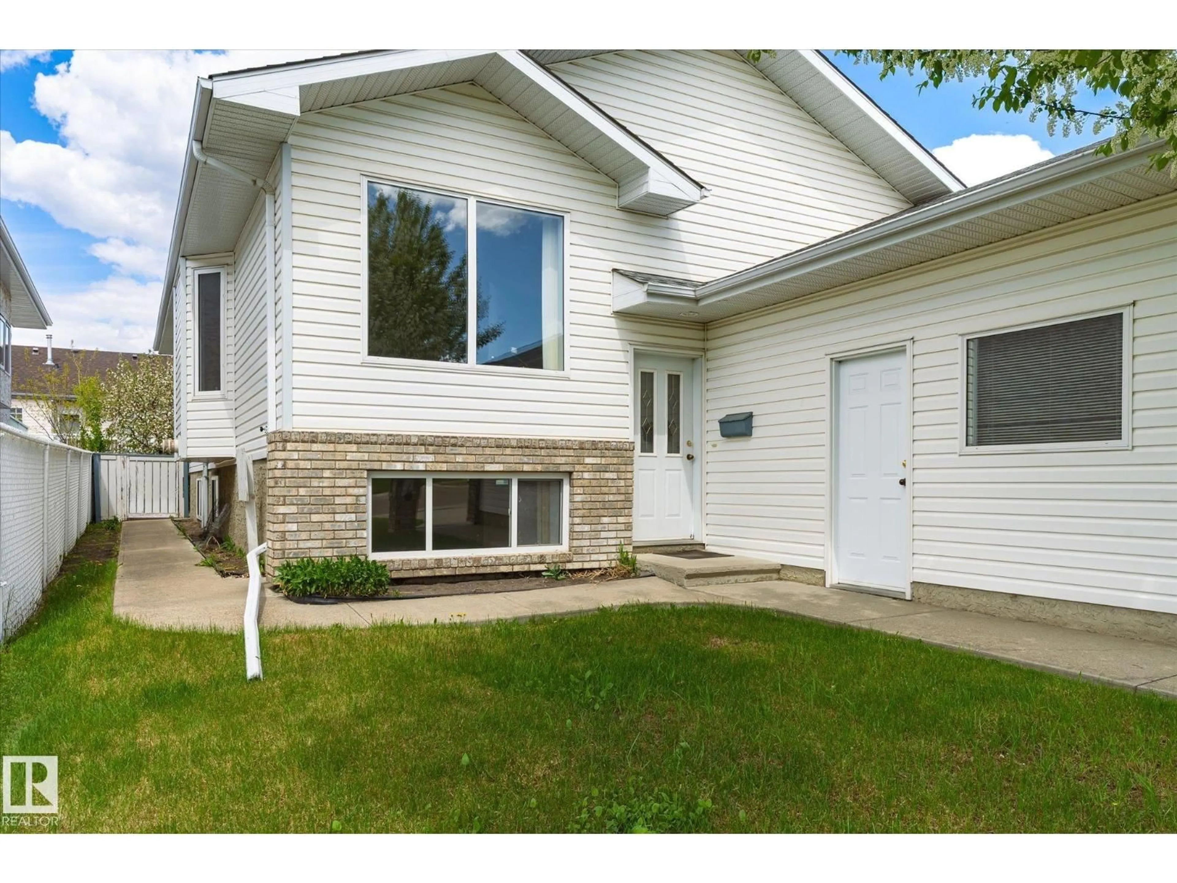 Home with vinyl exterior material, street for NW - 8604 157 AV, Edmonton Alberta T5Z3B3