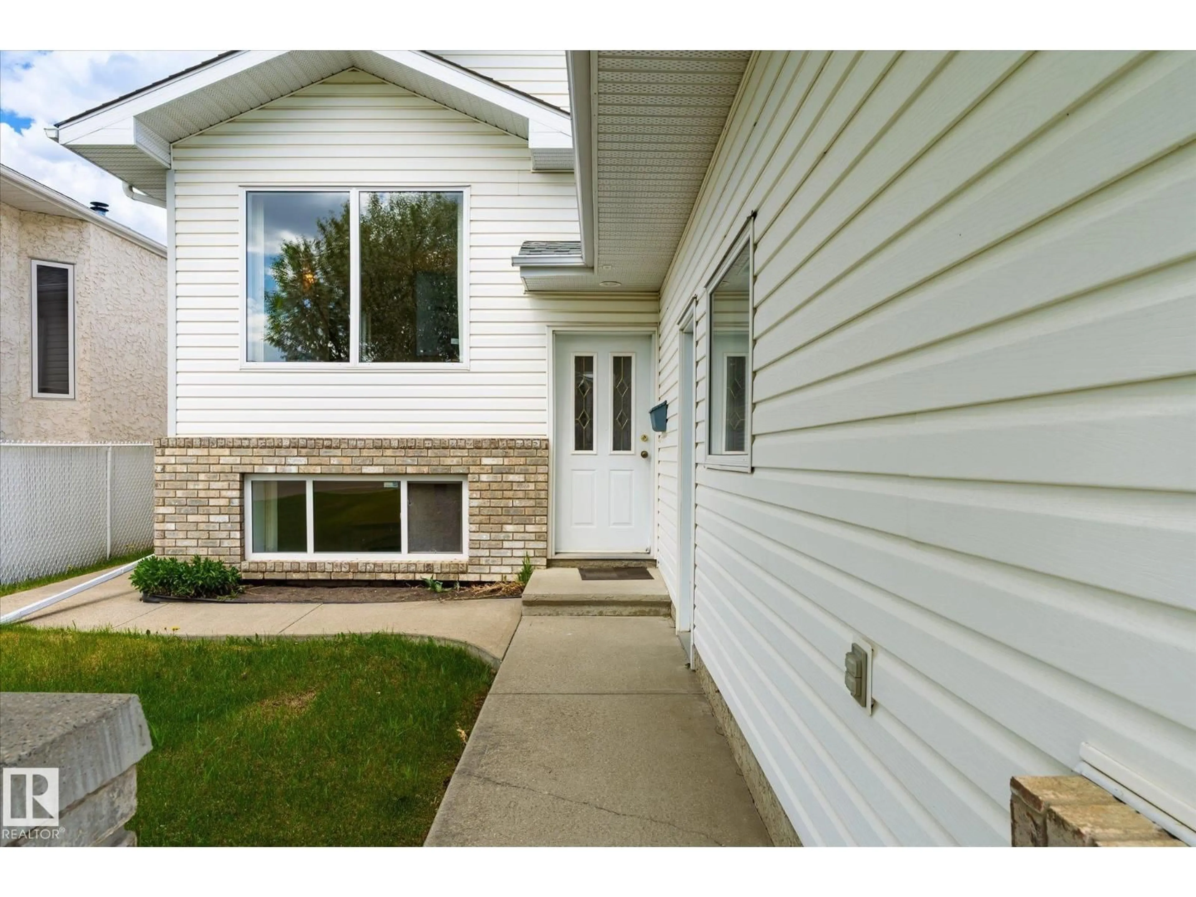 Home with vinyl exterior material, street for NW - 8604 157 AV, Edmonton Alberta T5Z3B3