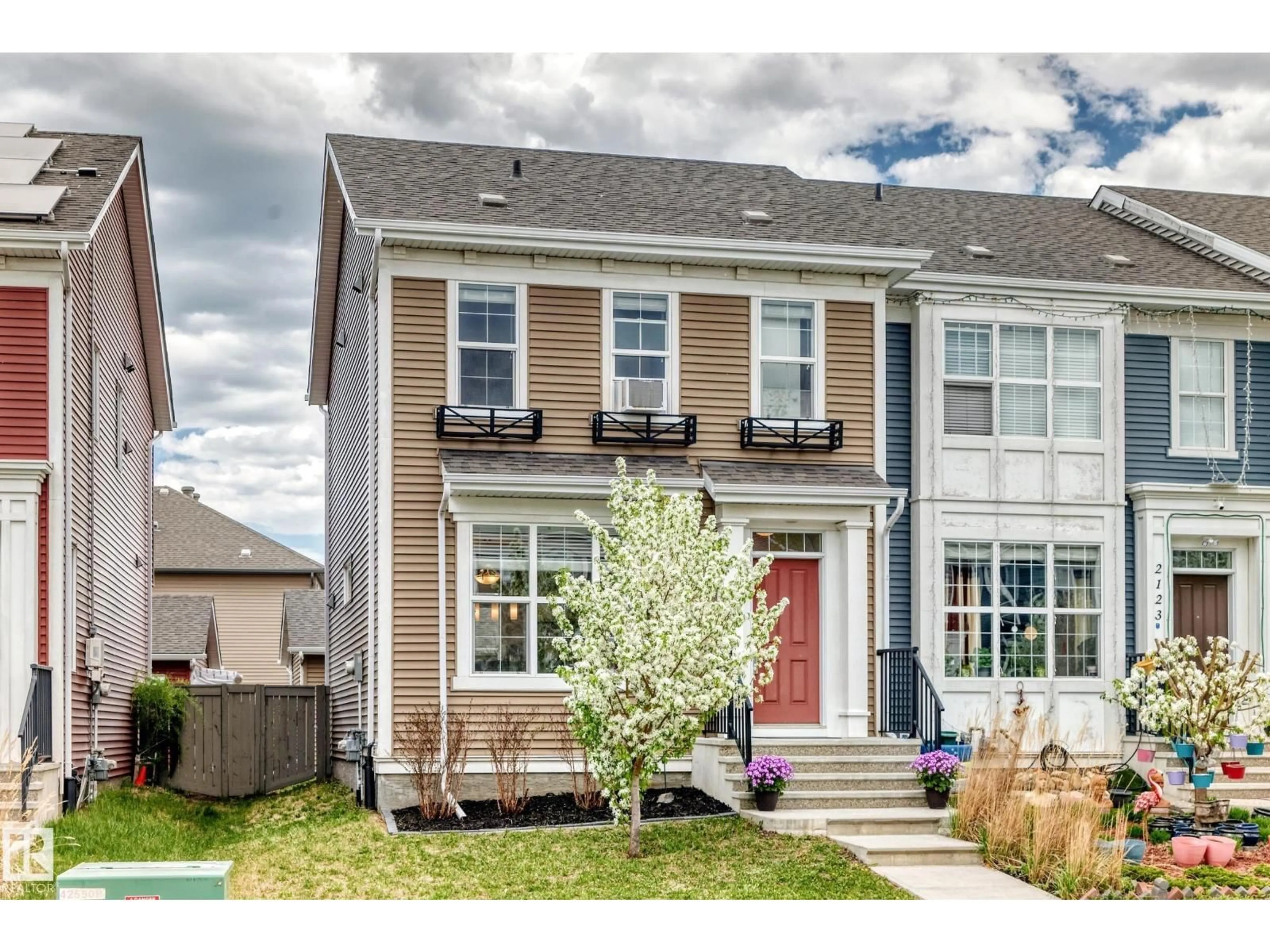 Home with vinyl exterior material, street for 2125 24 ST, Edmonton Alberta T6T0Y4