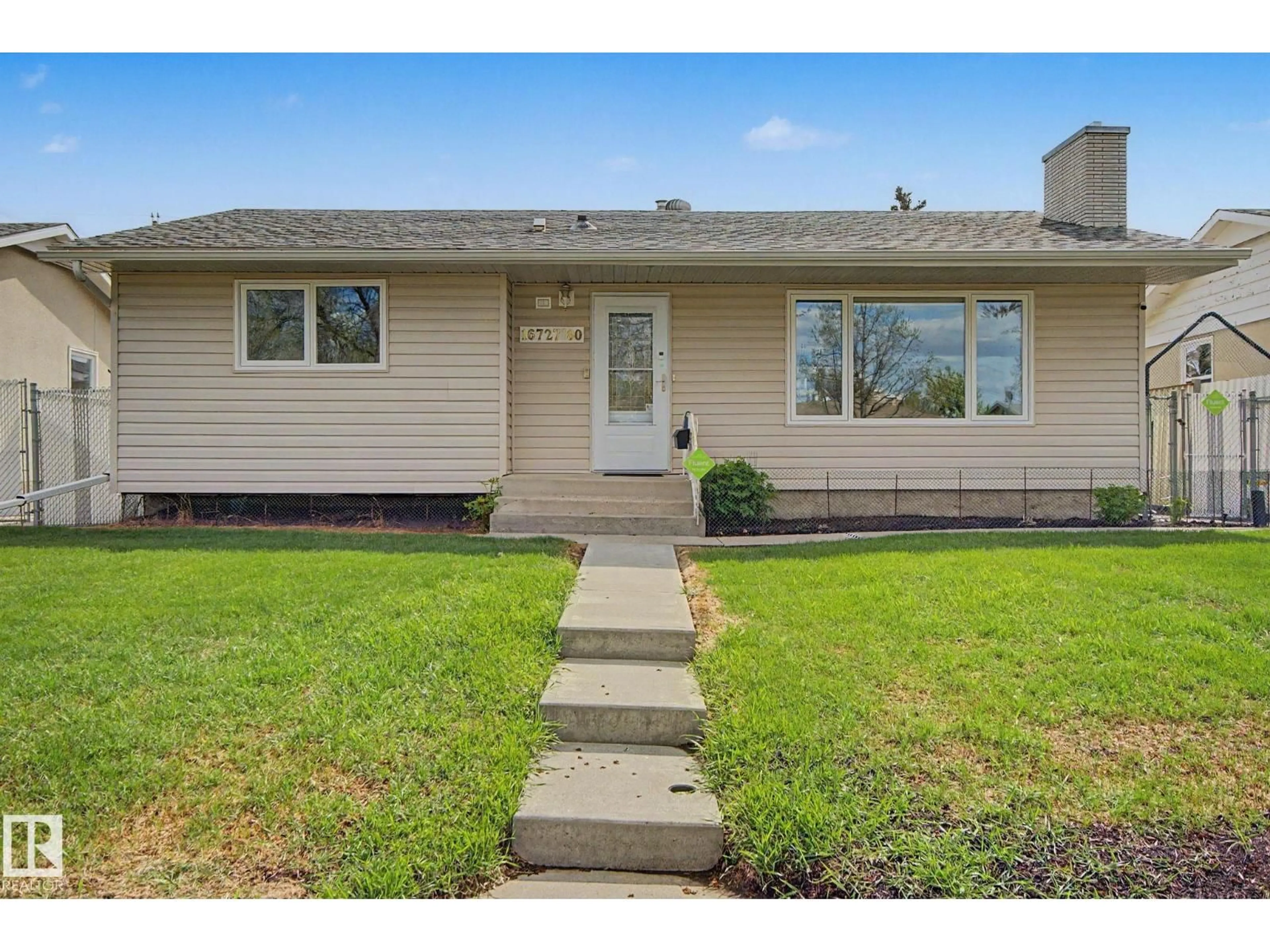 Home with vinyl exterior material, street for 16727 80 AV, Edmonton Alberta T5R3N1