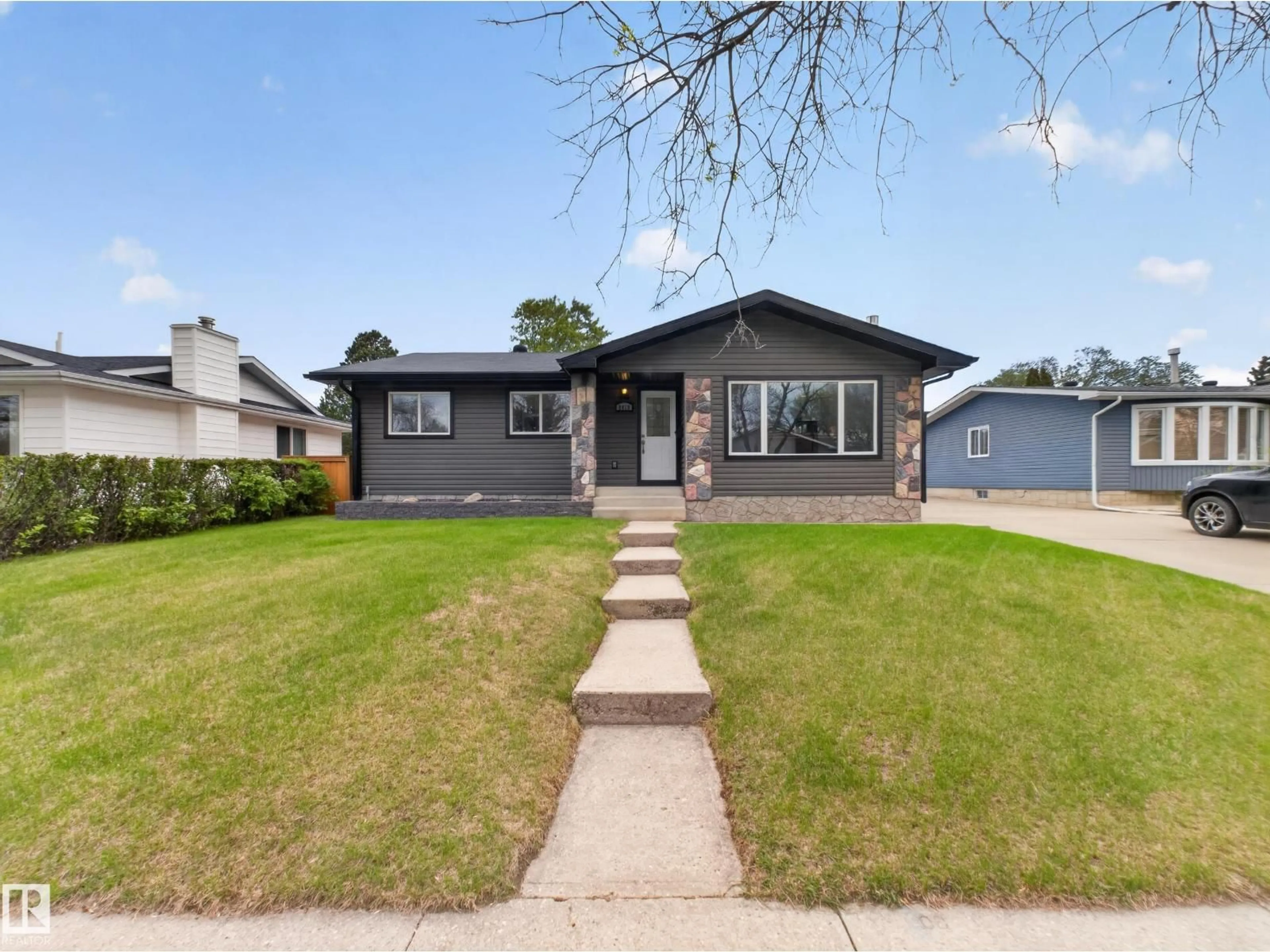 Home with vinyl exterior material, street for 8410 95B AVE, Fort Saskatchewan Alberta T8L2V6