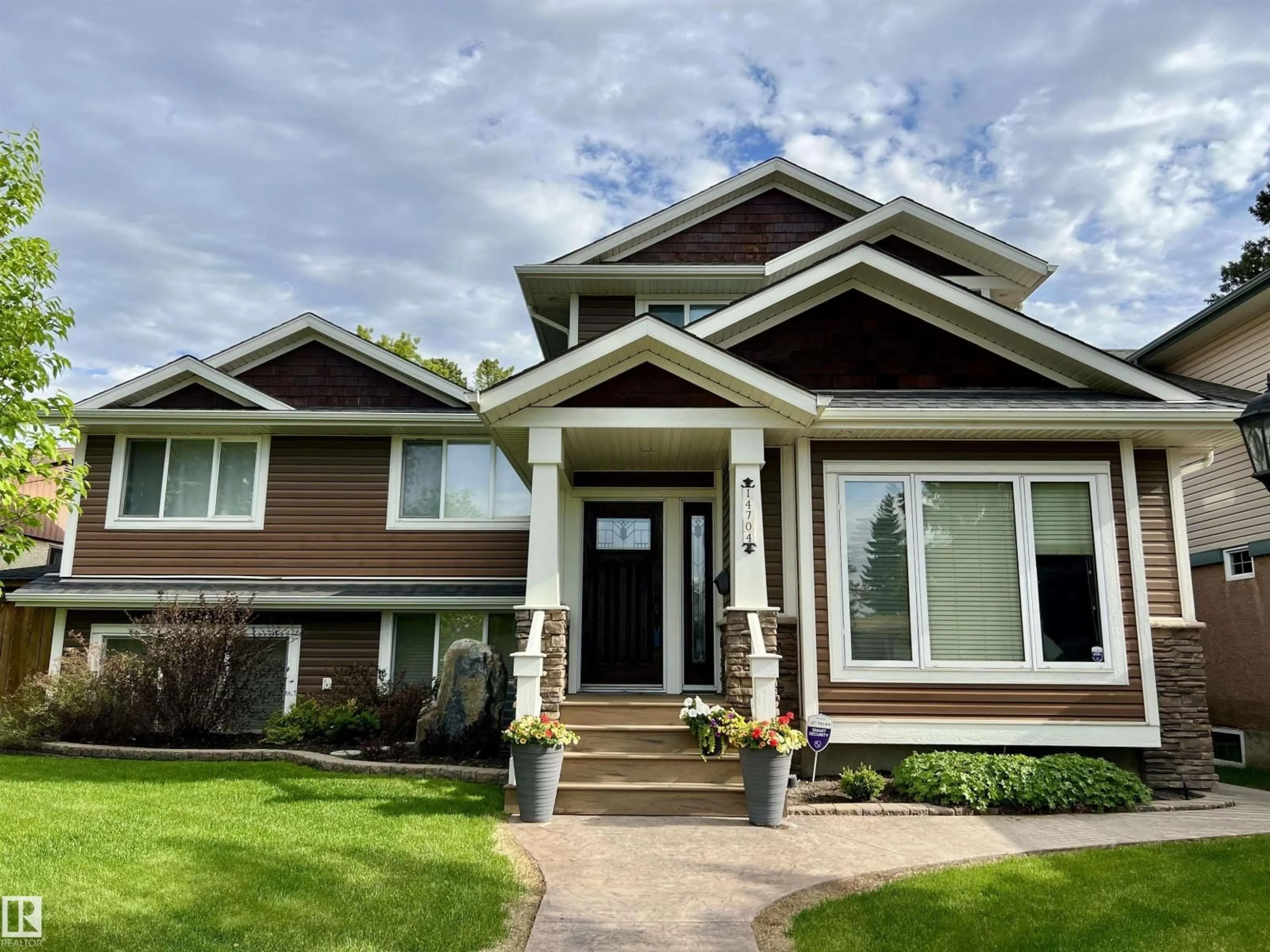 Home with vinyl exterior material, street for 14704 88 AV, Edmonton Alberta T5R4J8